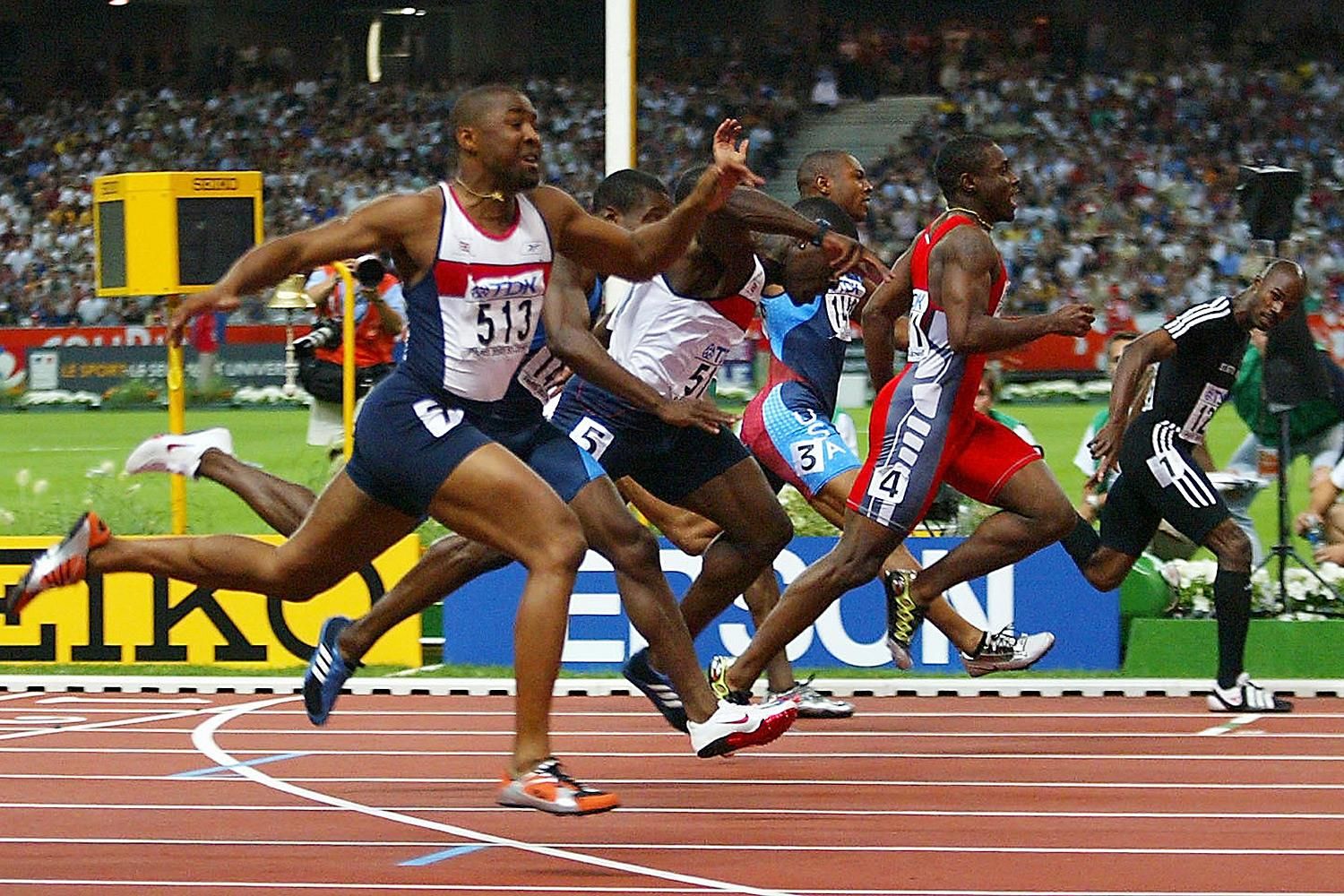 Kim Collins (far right) wins the 100m at the 2003 IAAF World Championships in Paris