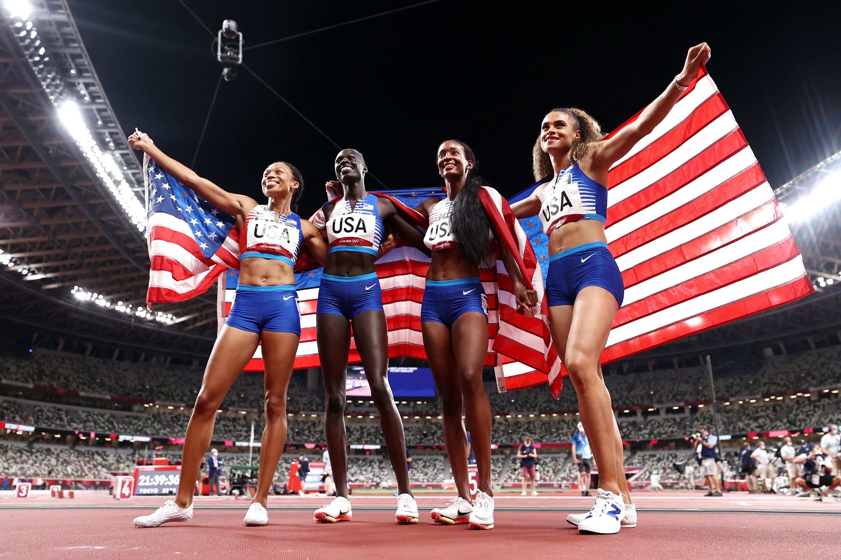 Allyson Felix, Athing Mu, Dalilah Muhammad and Sydney McLaughlin after the 4x400m in Tokyo