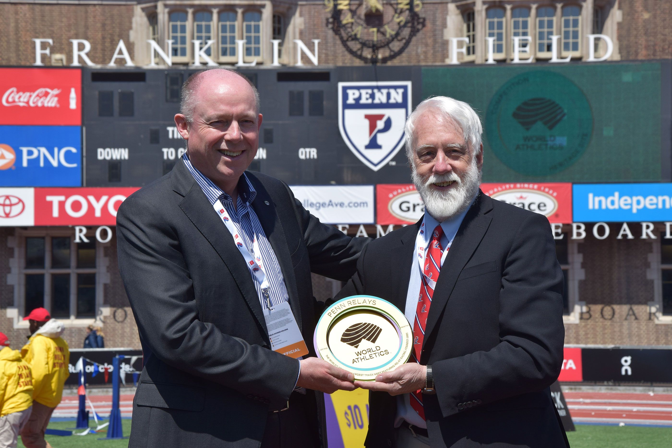 Chris Turner with Dave Johnson and the Penn Relays Heritage Plaque