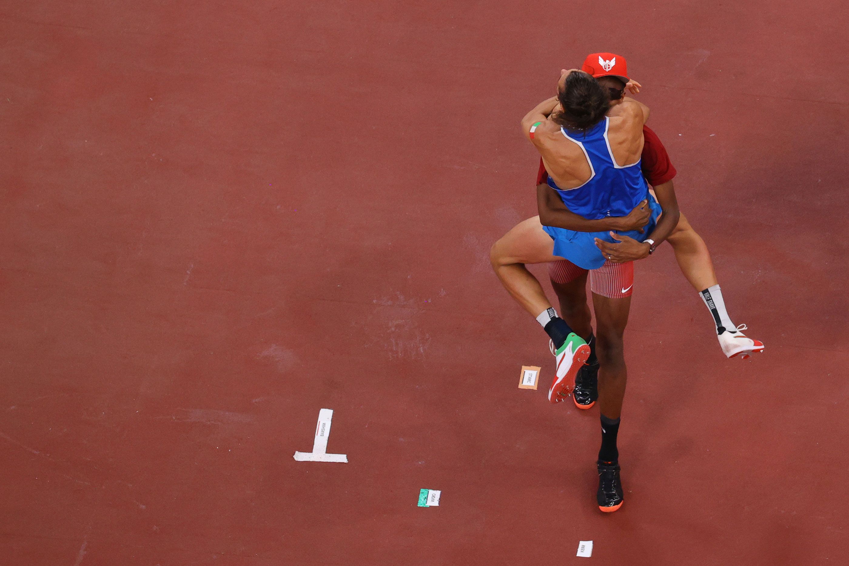 Mutaz Barshim and Gianmarco Tamberi celebrate their joint Olympic high jump gold in Tokyo