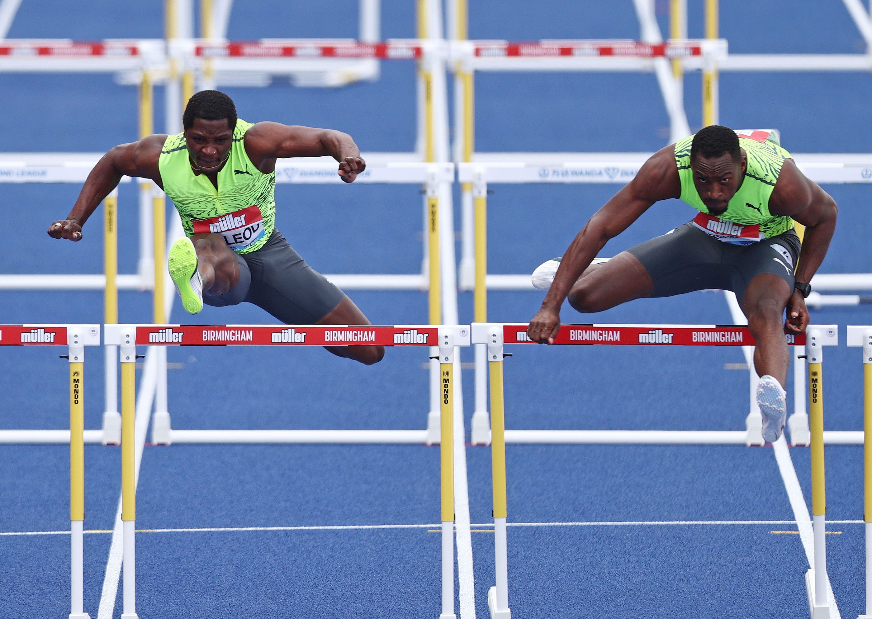 Omar McLeod battles with eventual winner Hansle Parchment in the 110m hurdles in Birmingham