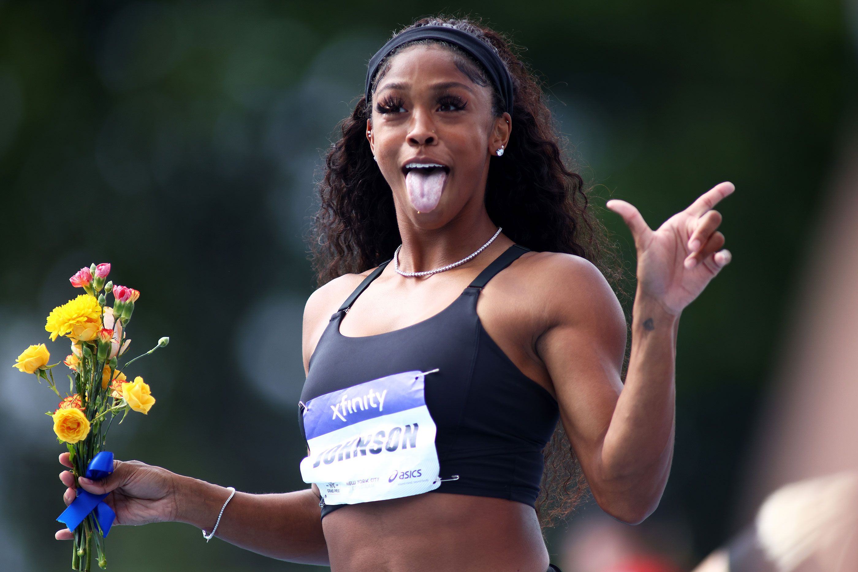 Alaysha Johnson celebrates her 100m hurdles win in New York