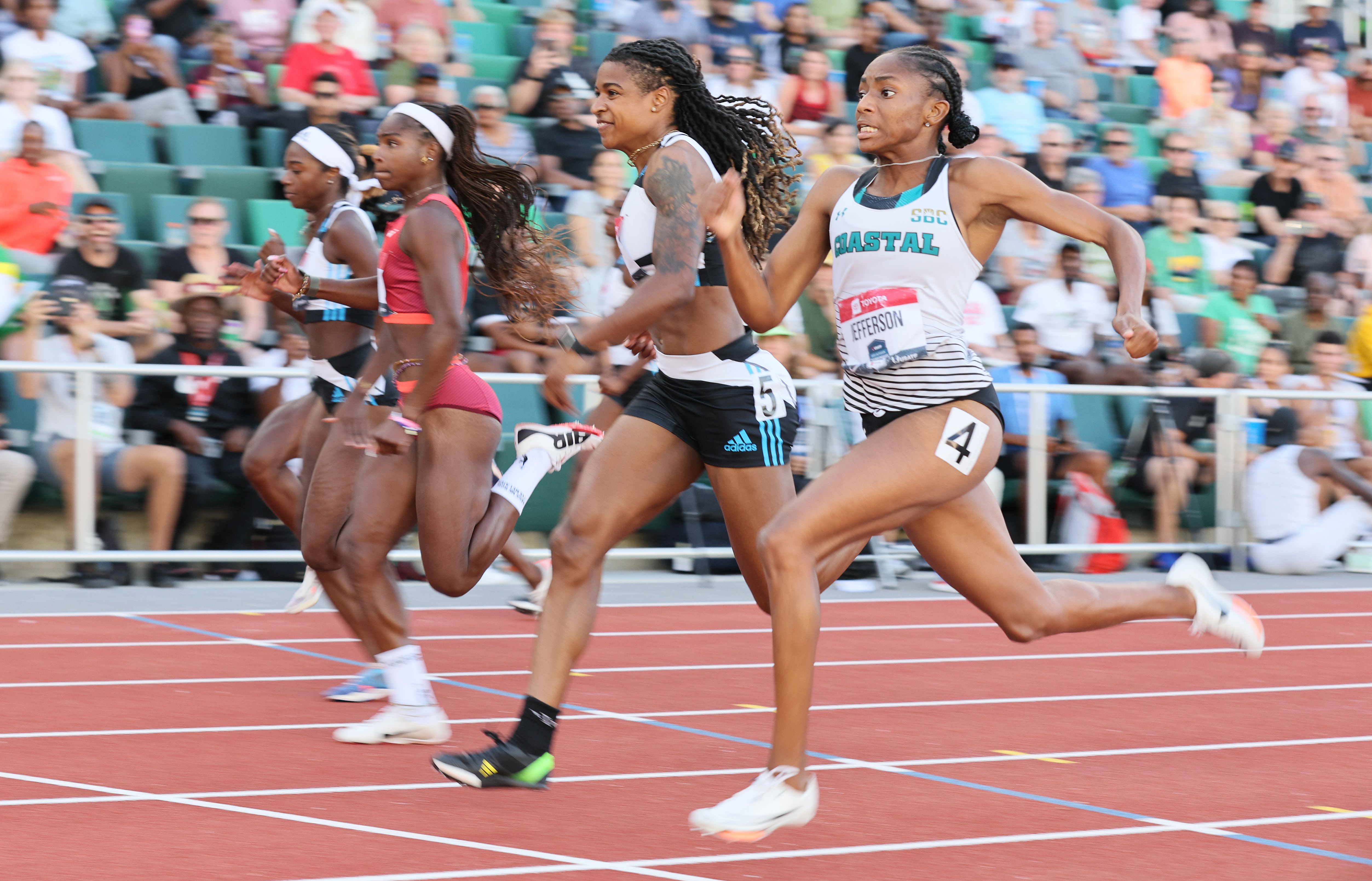 Melissa Jefferson (right) wins the 100m at the US Championships