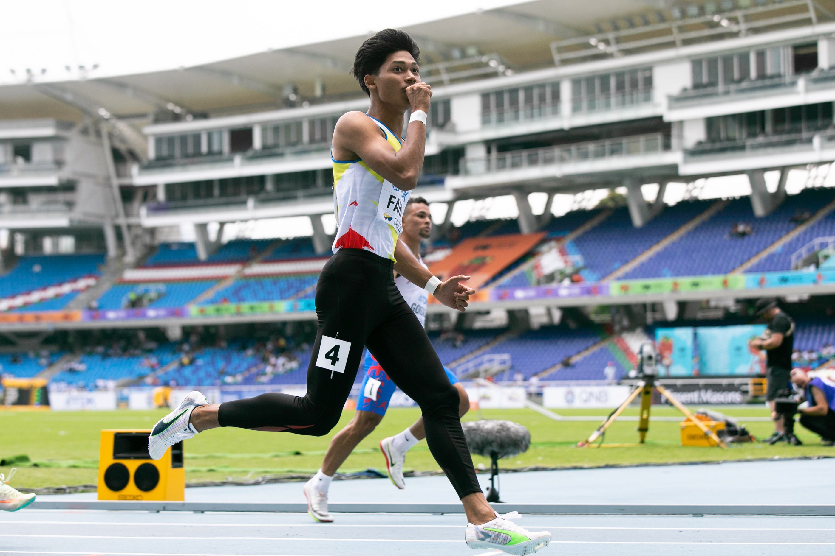 Muhd Azeem Fahmi of Malaysia celebrates his run in the world U20 100m heats in Cali