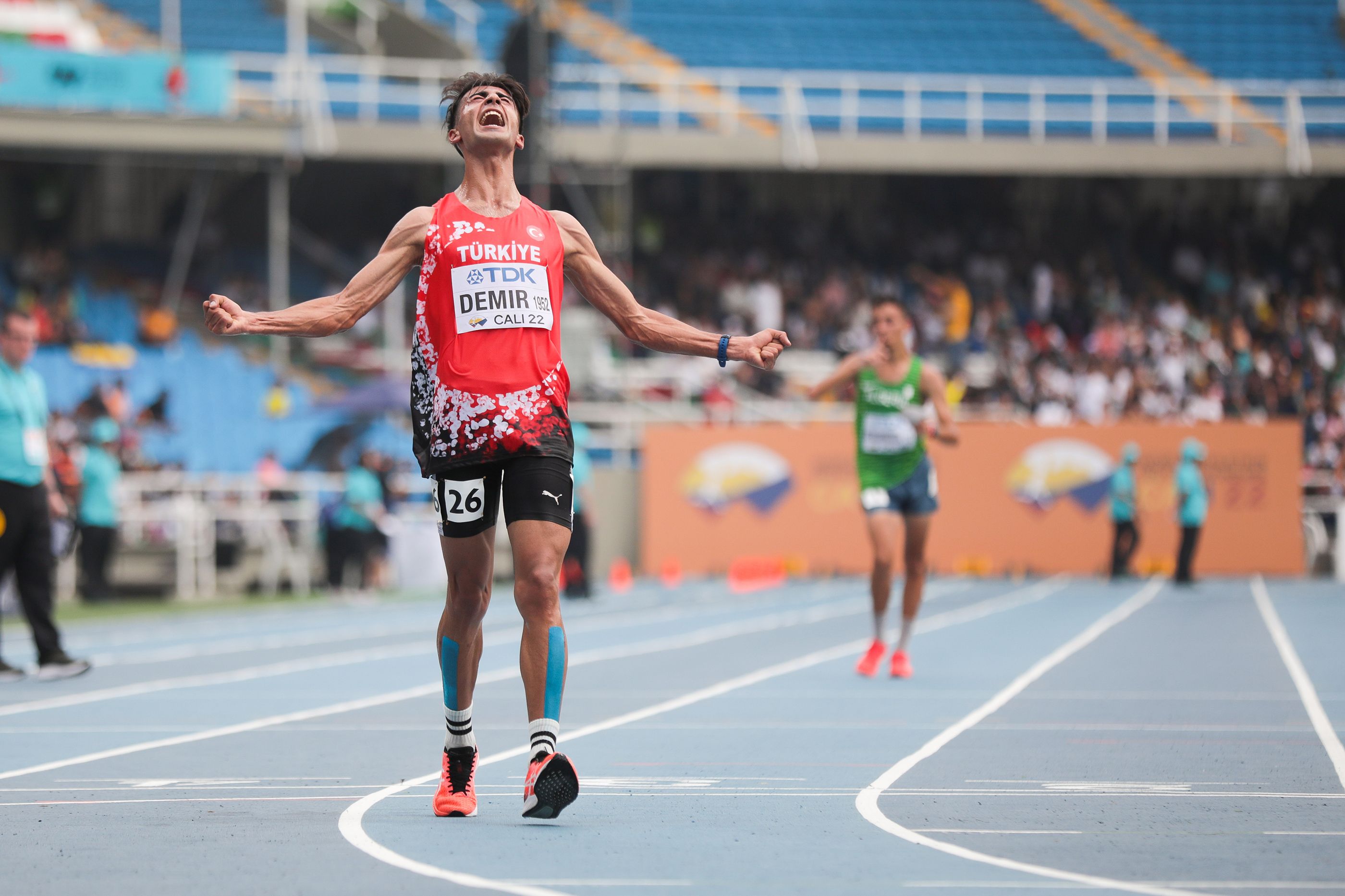 Mazlum Demir of Turkey celebrates his world U20 10,000m race walk win in Cali