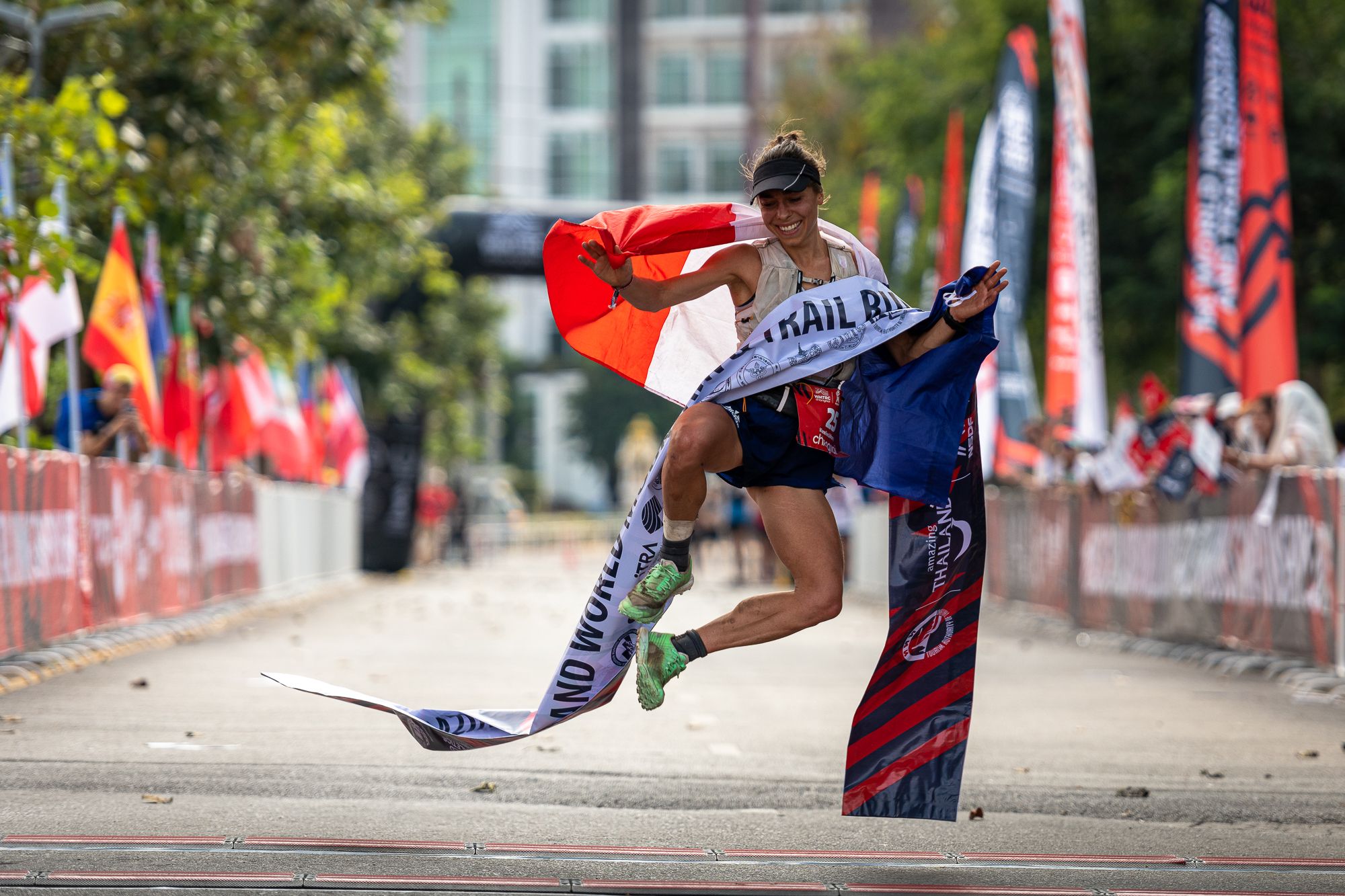 Blandine L'Hirondel celebrates her women’s long trail win at the World Mountain and Trail Running Championships