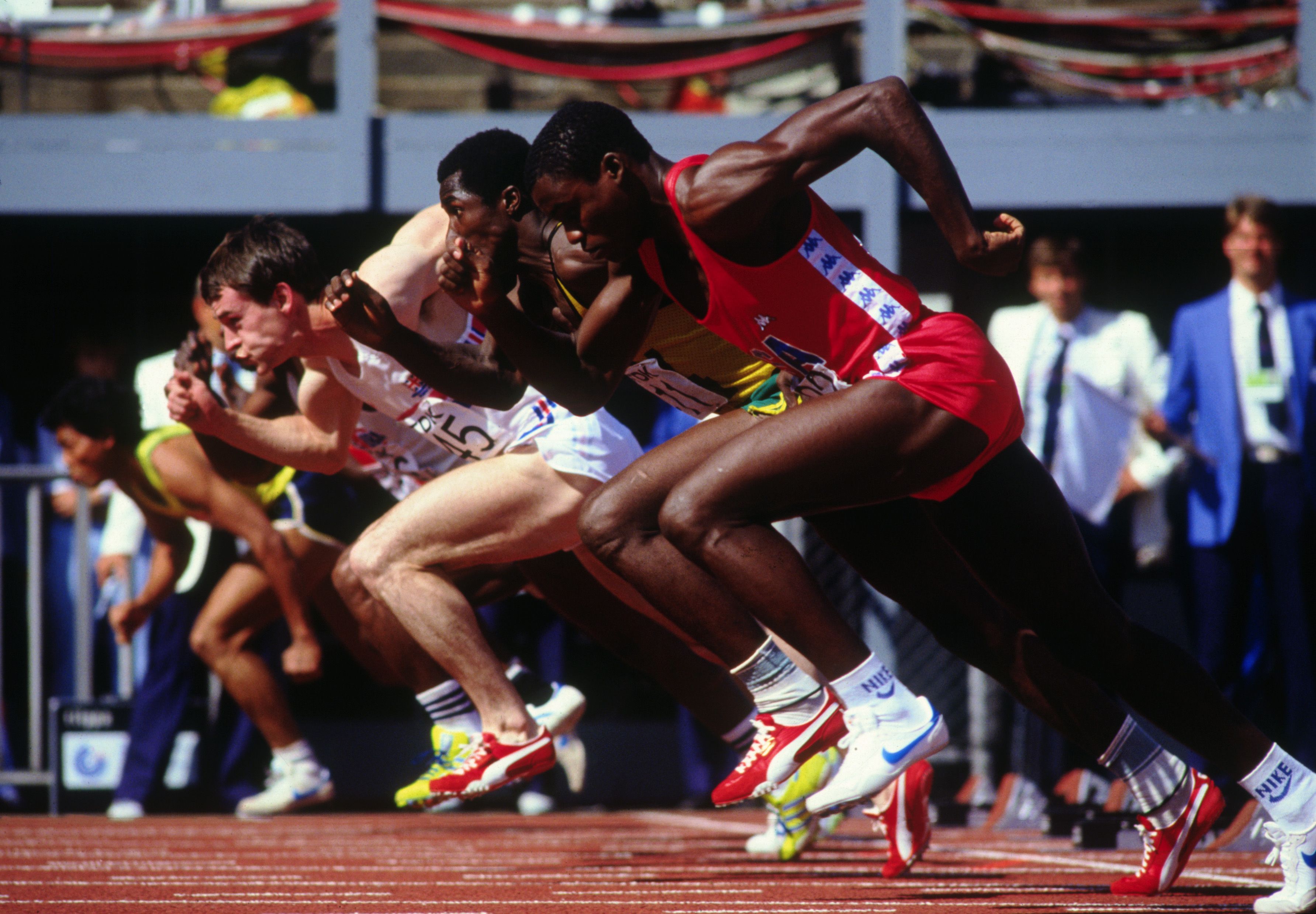 Carl Lewis of the USA races off of the starting blocks