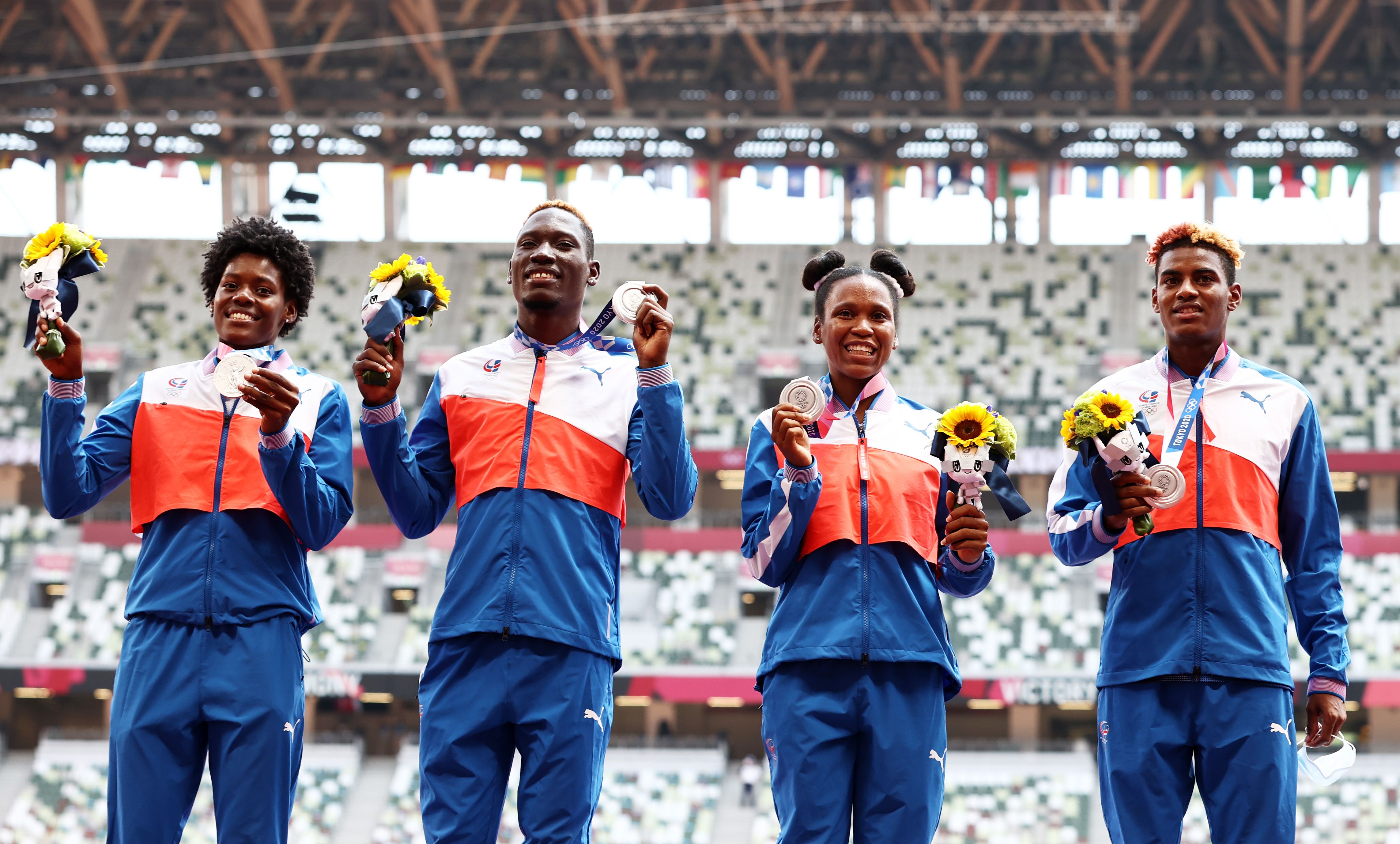 The Dominican Republic mixed relay team with their Olympic silver medals in Tokyo