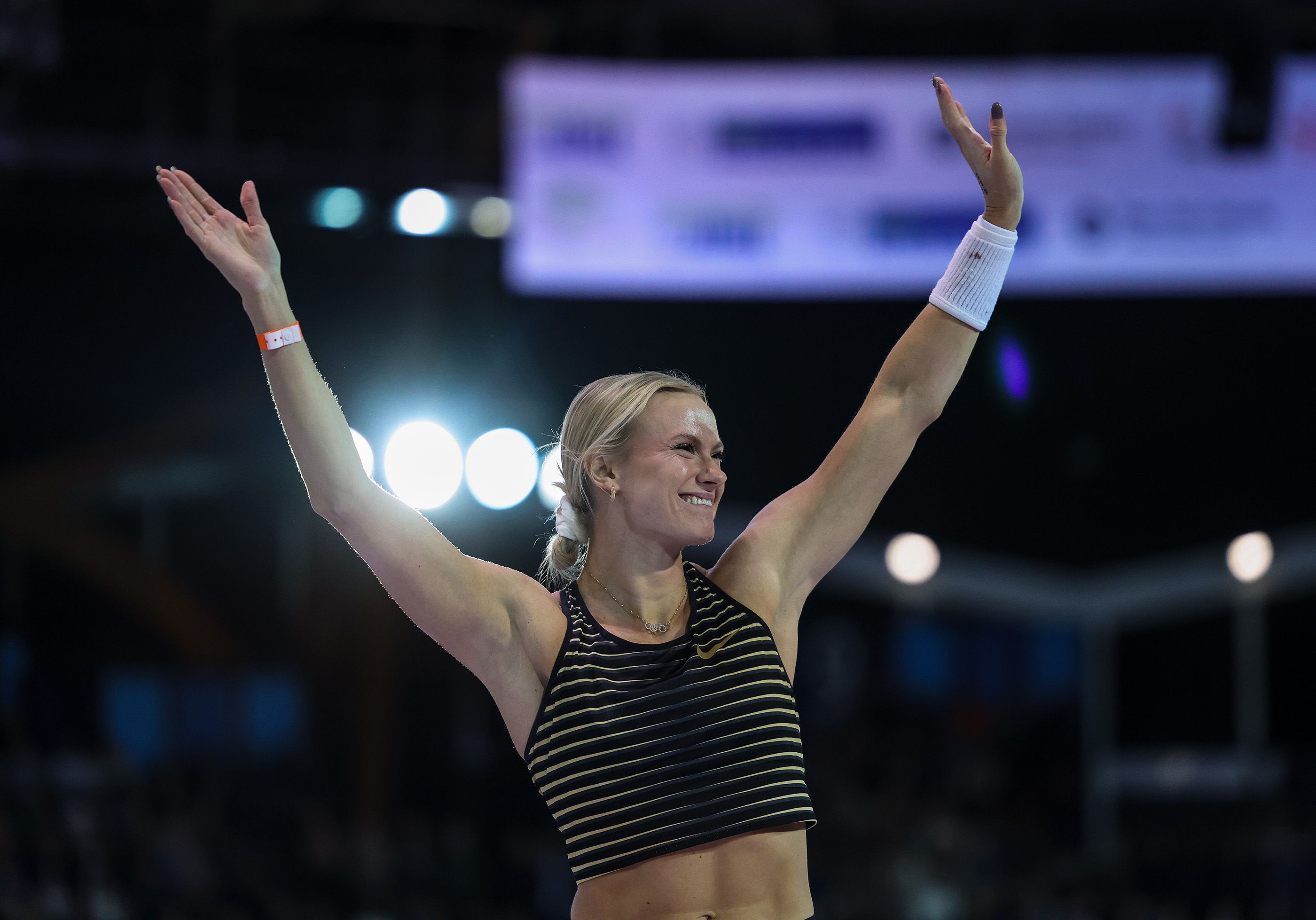 Katie Moon celebrates her world-leading pole vault performance in Lievin