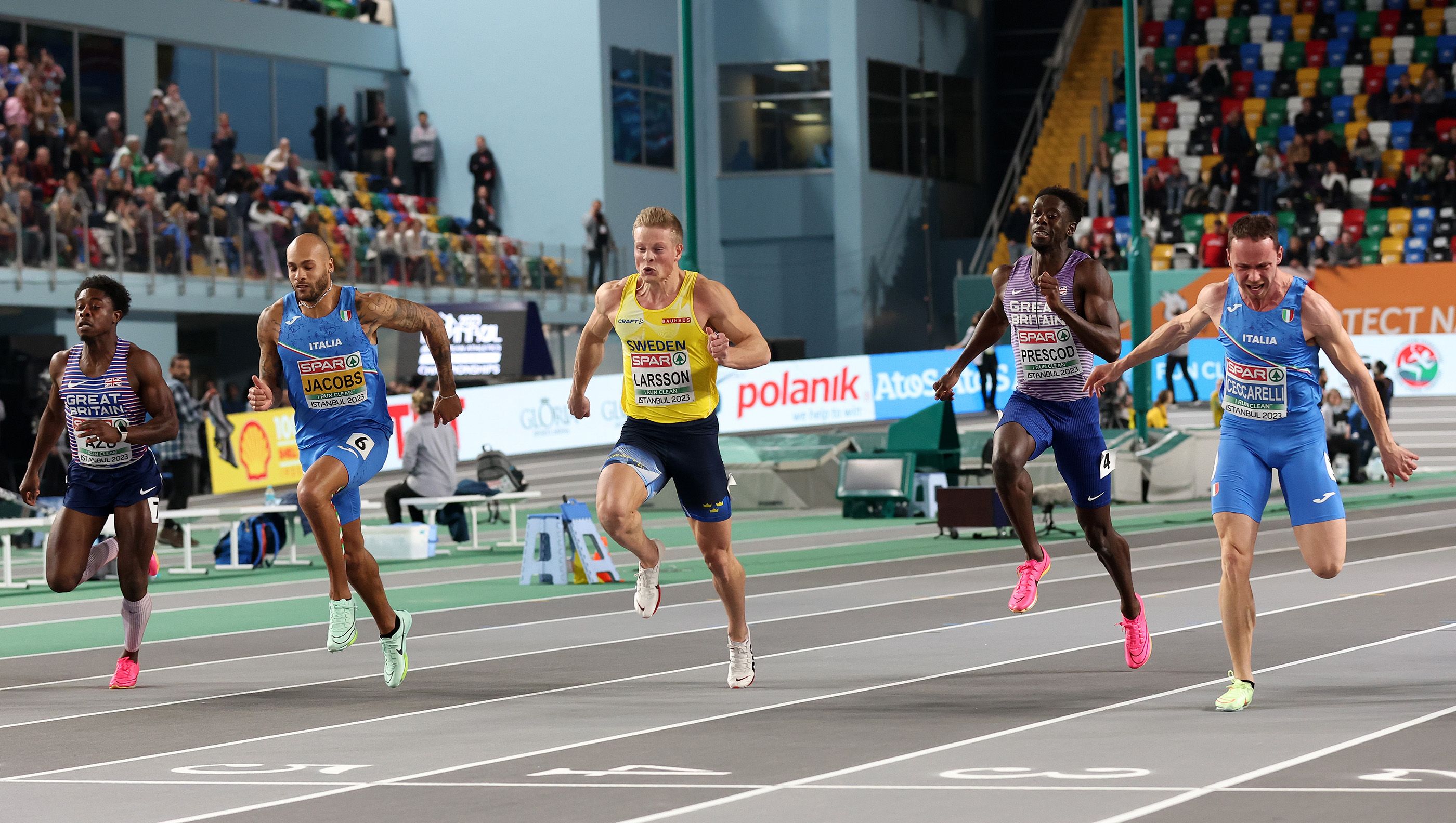 Athletes fight for the line in the men's European indoor 60m final, won by Samuele Ceccarelli