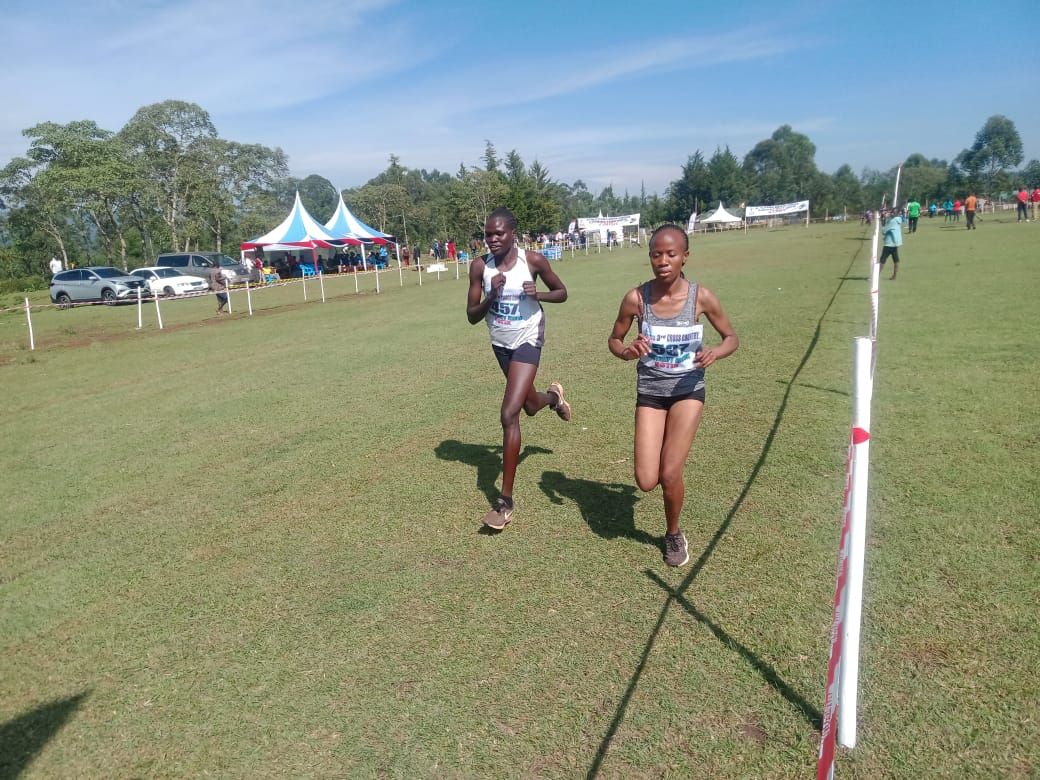 U20 ART athlete Perina Lokure Nakang (left) in cross country action