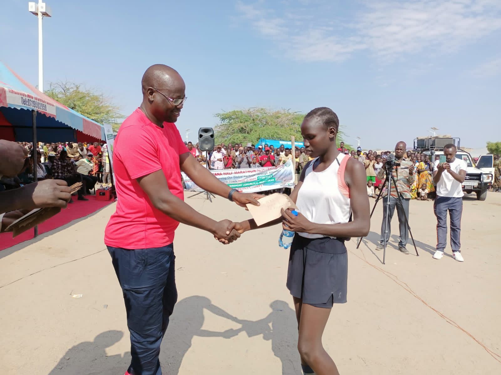 Zinad Joseph receives her prize money