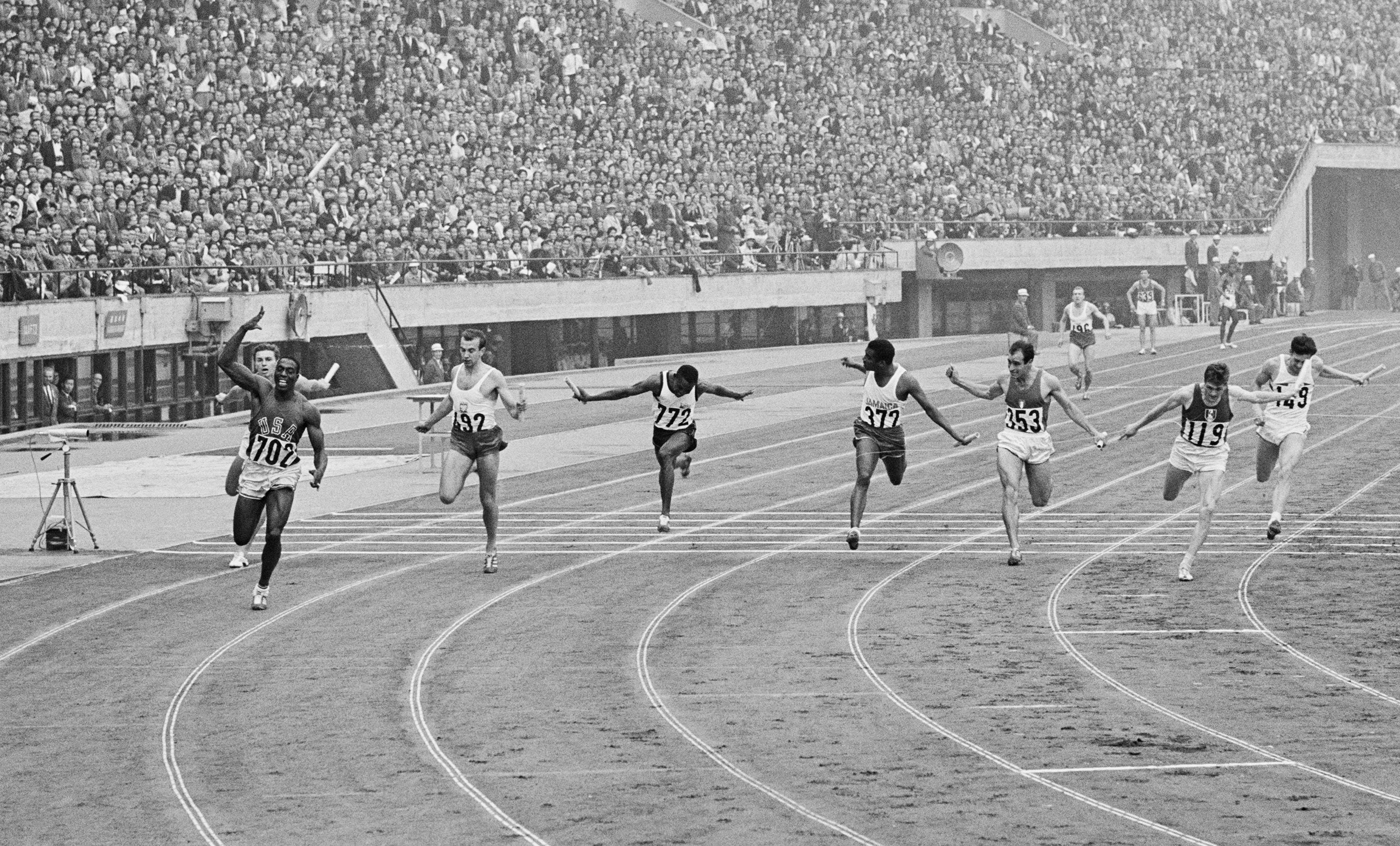 Bob Hayes (702) in the 4x100m at the Tokyo Olympics