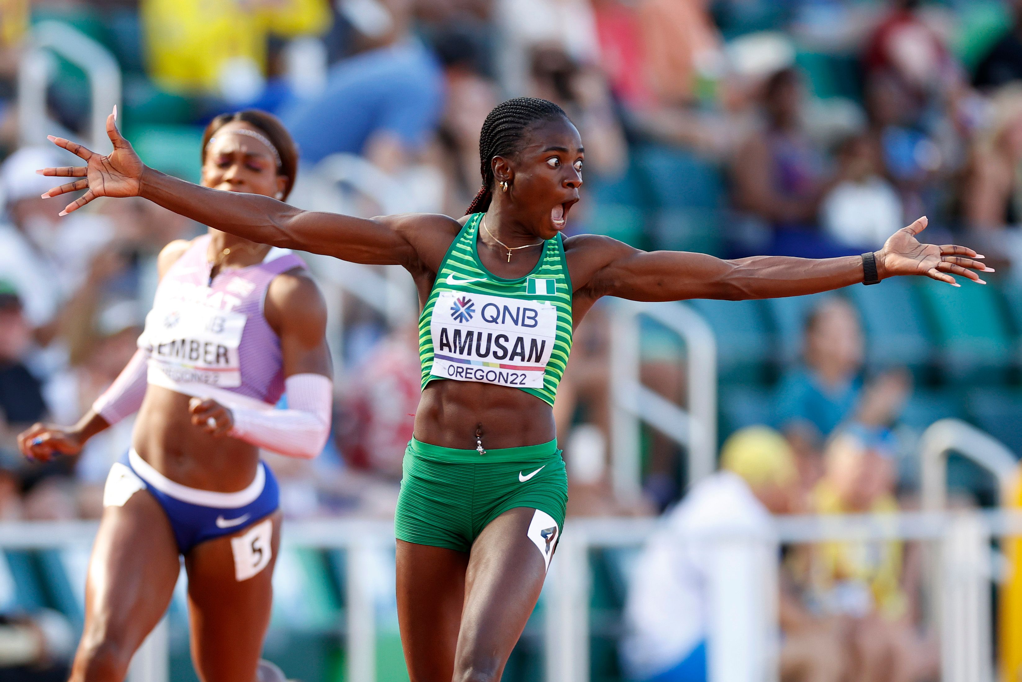 Tobi Amusan celebrates after crossing the line in Oregon