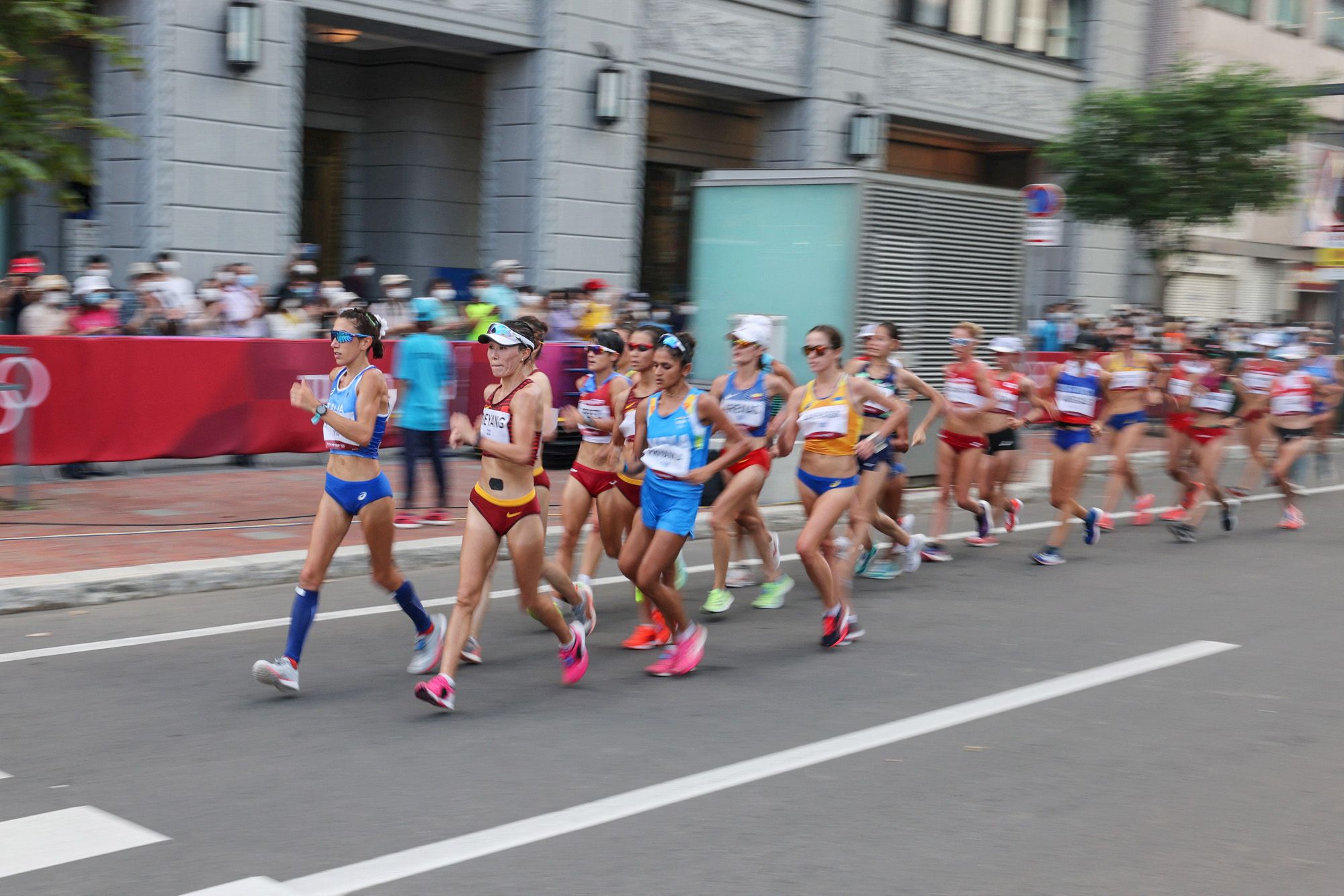 Athletes in action in the women's 20km race walk at the Tokyo Olympic Games