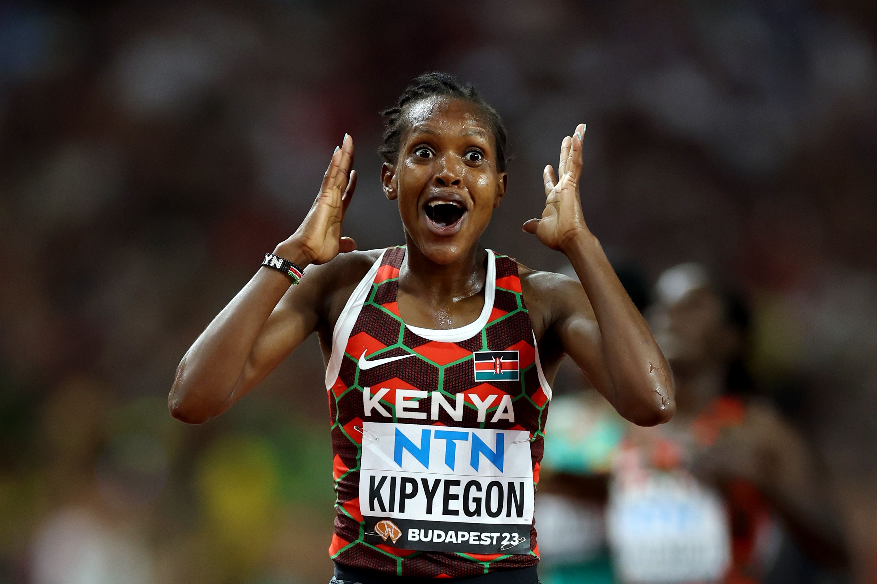 Faith Kipyegon celebrates her world 5000m title win in Budapest