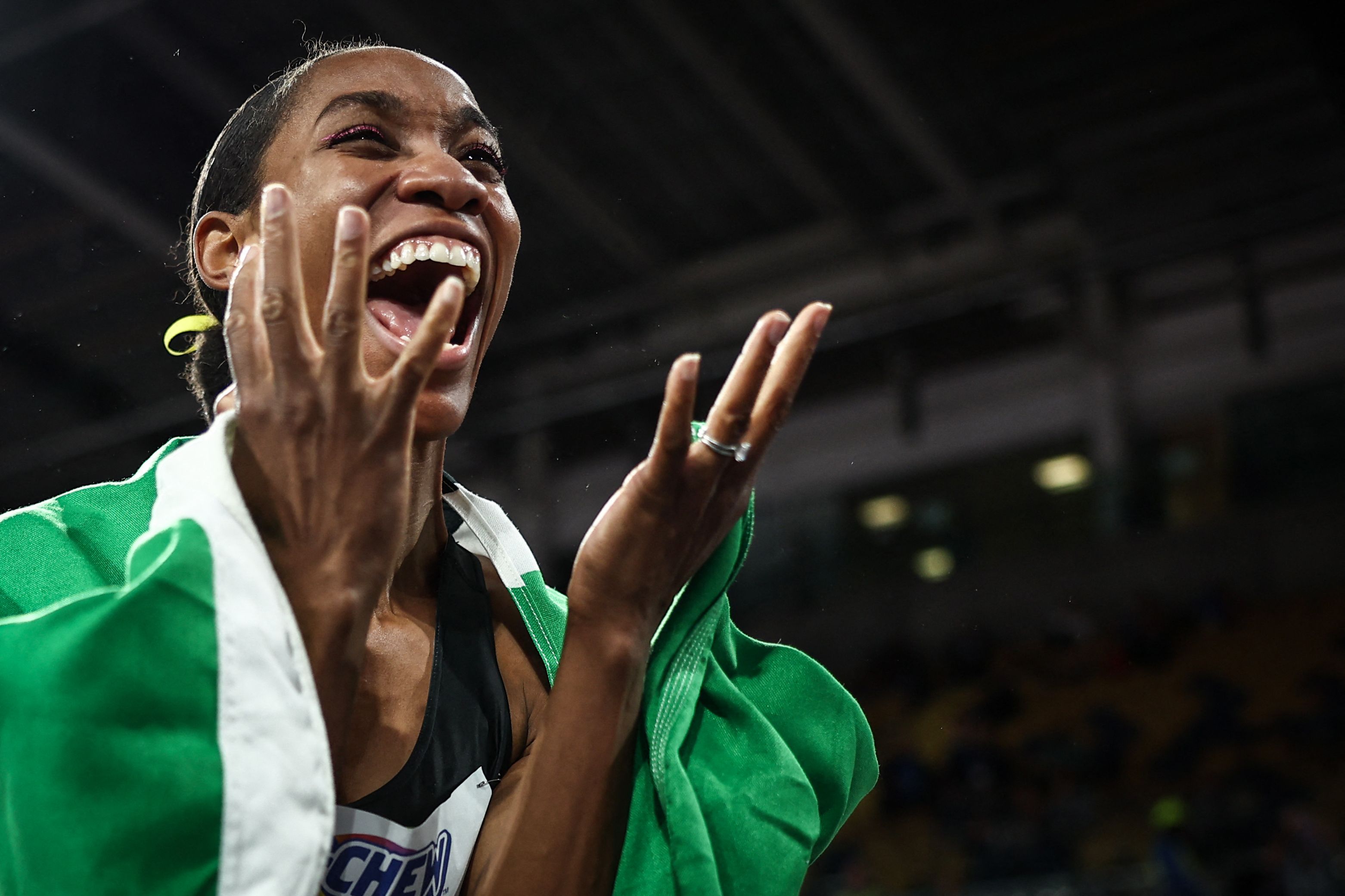 Thea LaFond celebrates her world indoor triple jump title win in Glasgow