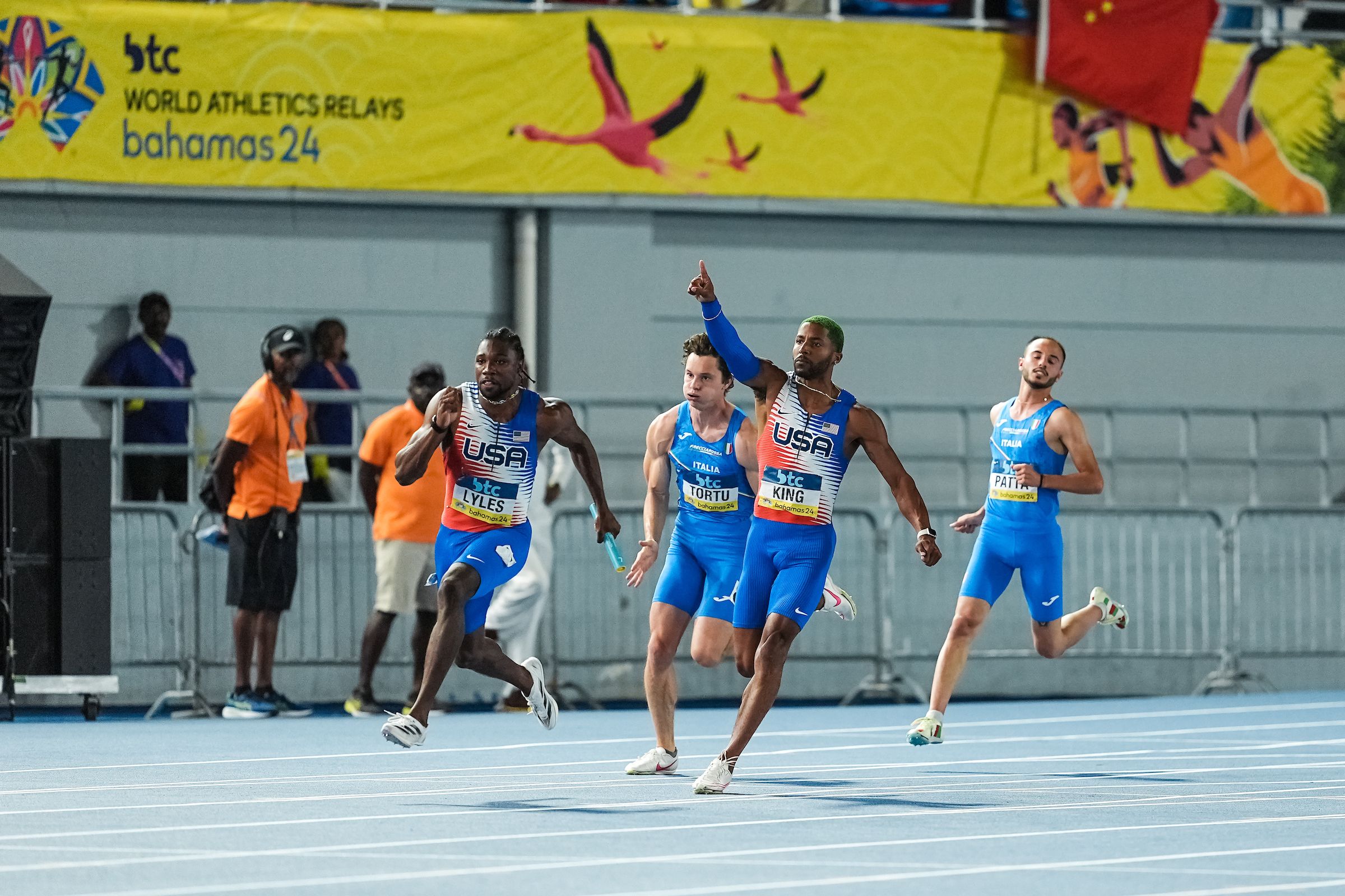 Noah Lyles heads out for the final leg of the men's 4x100m at the WRE Bahamas 24