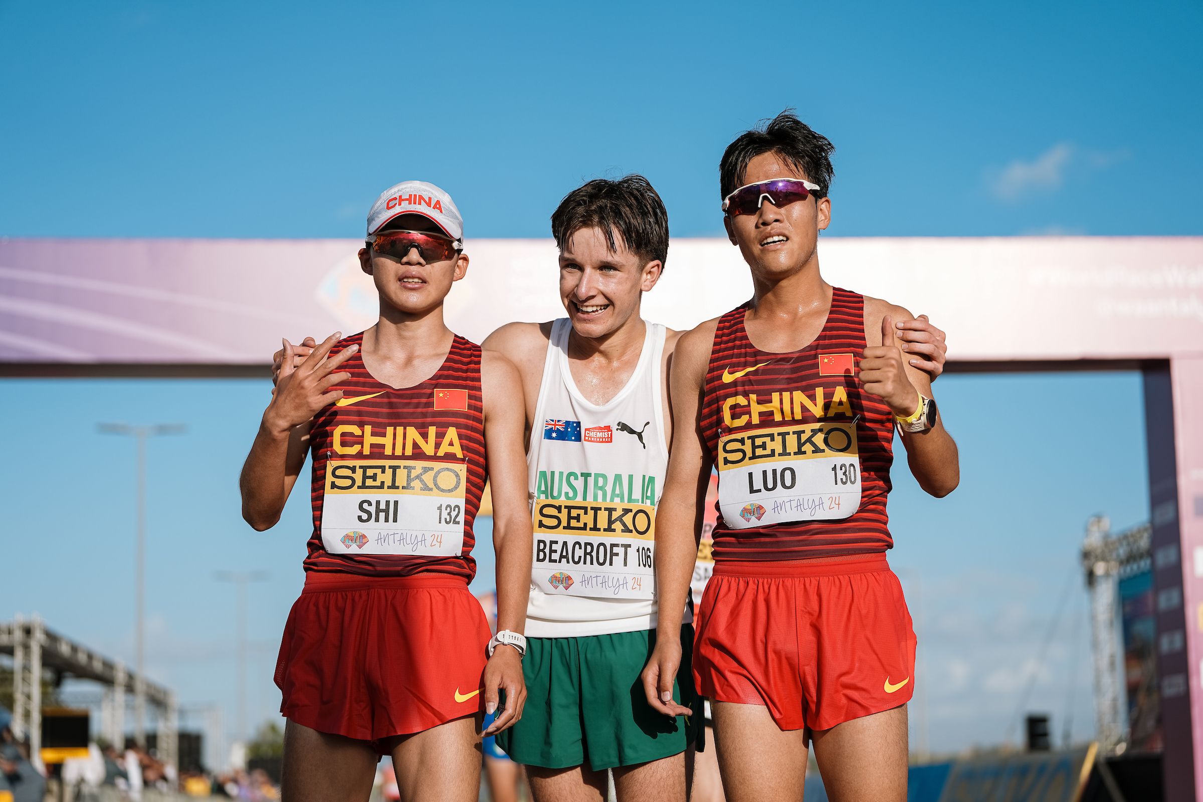 Isaac Beacroft with his fellow World Race Walking Team Championships medallists Shi Shengji and Luo Jiawei
