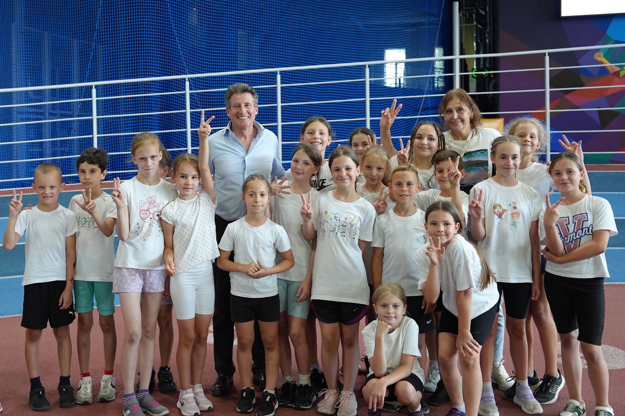 Sebastian Coe with young athletes in Ukraine