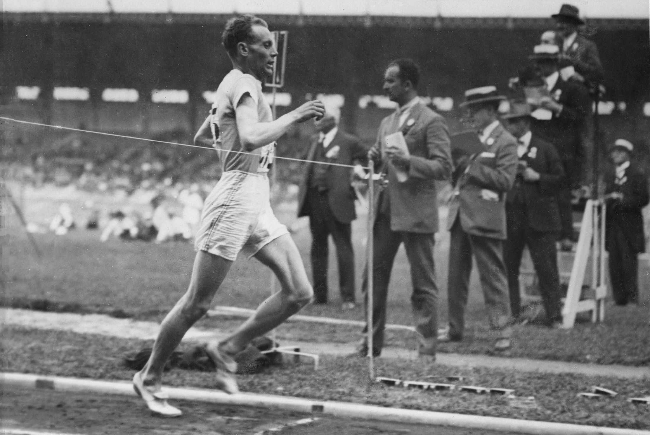 Time keepers at the finish line as Paavo Nurmi competes at the 1924 Olympic Games