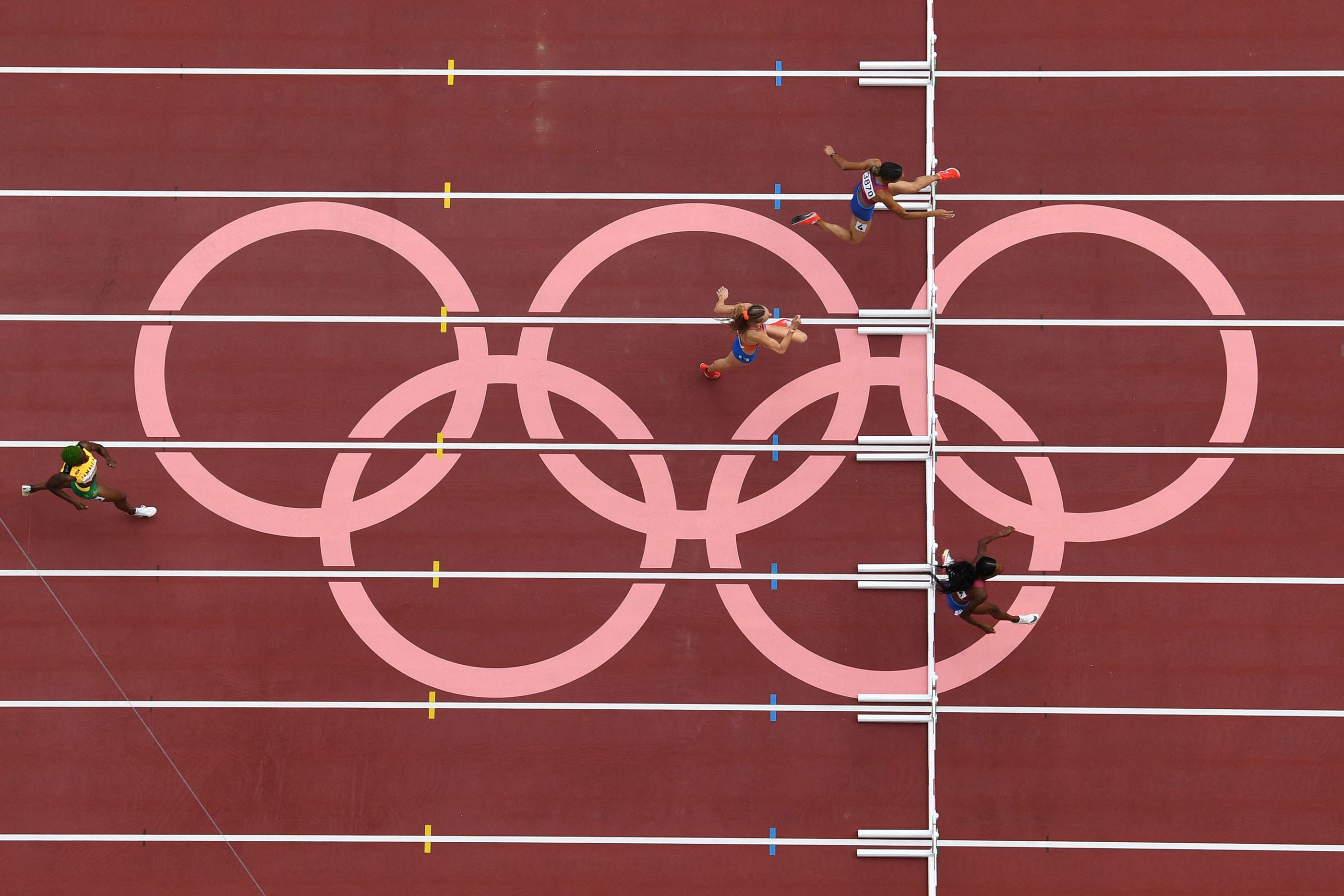 Sydney McLaughlin-Levrone (top) on her way to a world 400m hurdles record at the Tokyo Olympics