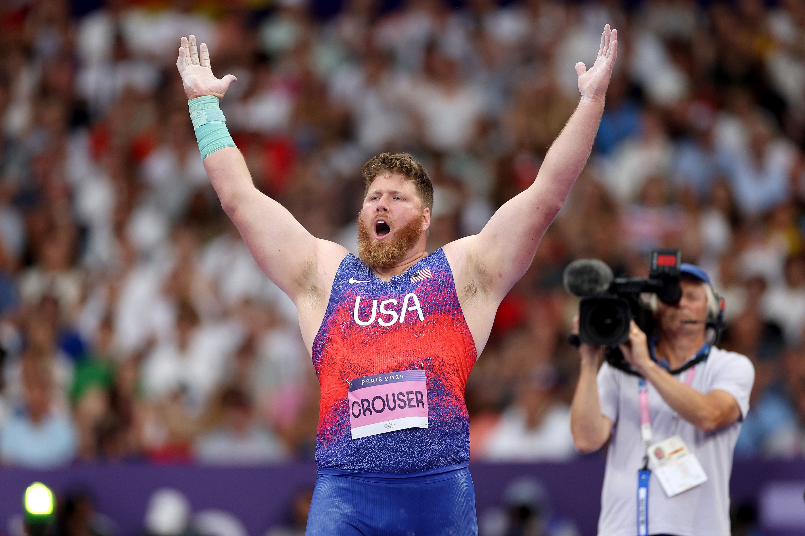 Three-time Olympic shot put champion Ryan Crouser celebrates in Paris