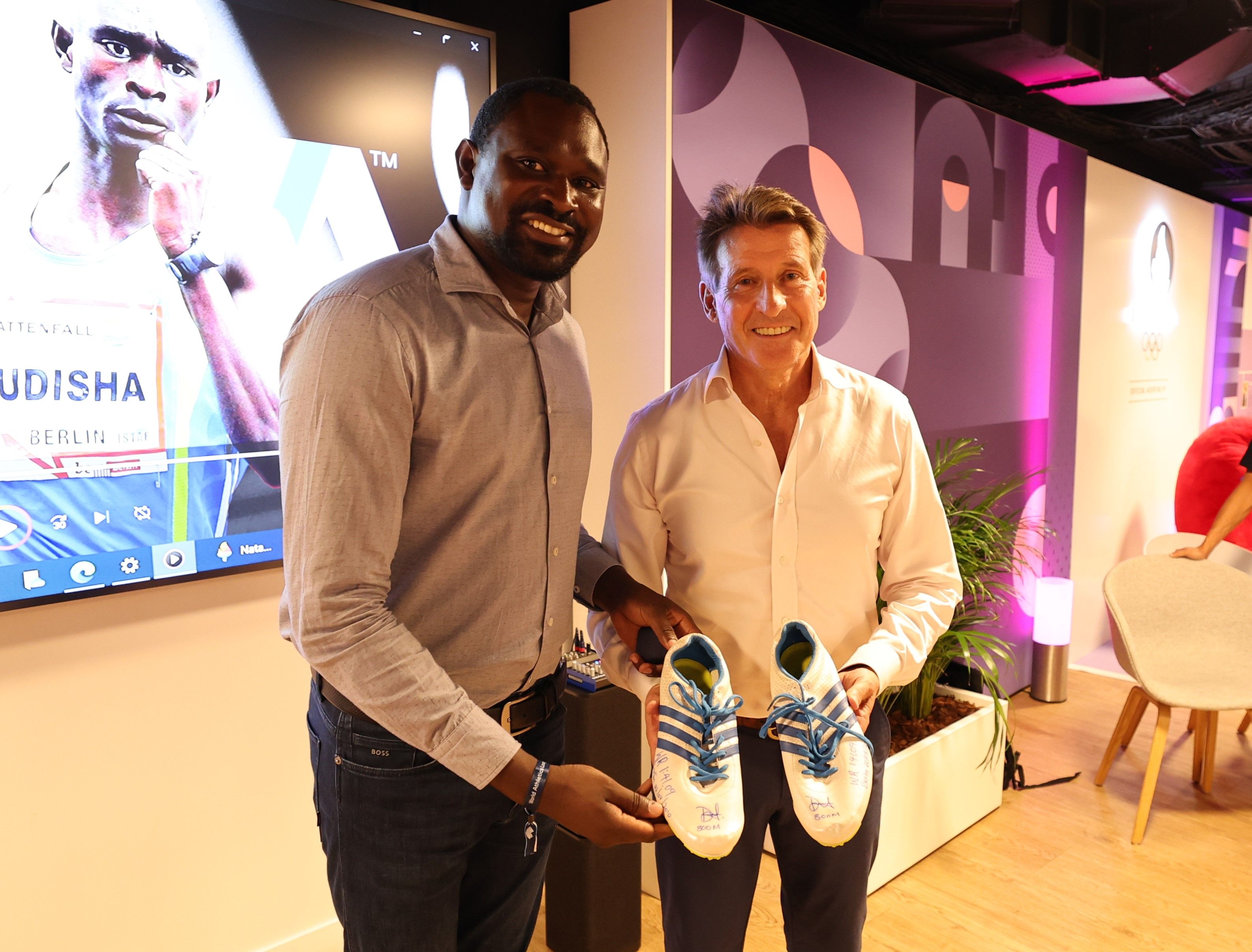 David Rudisha hands over his 1:41.09 world record spikes to Sebastian Coe for the MOWA