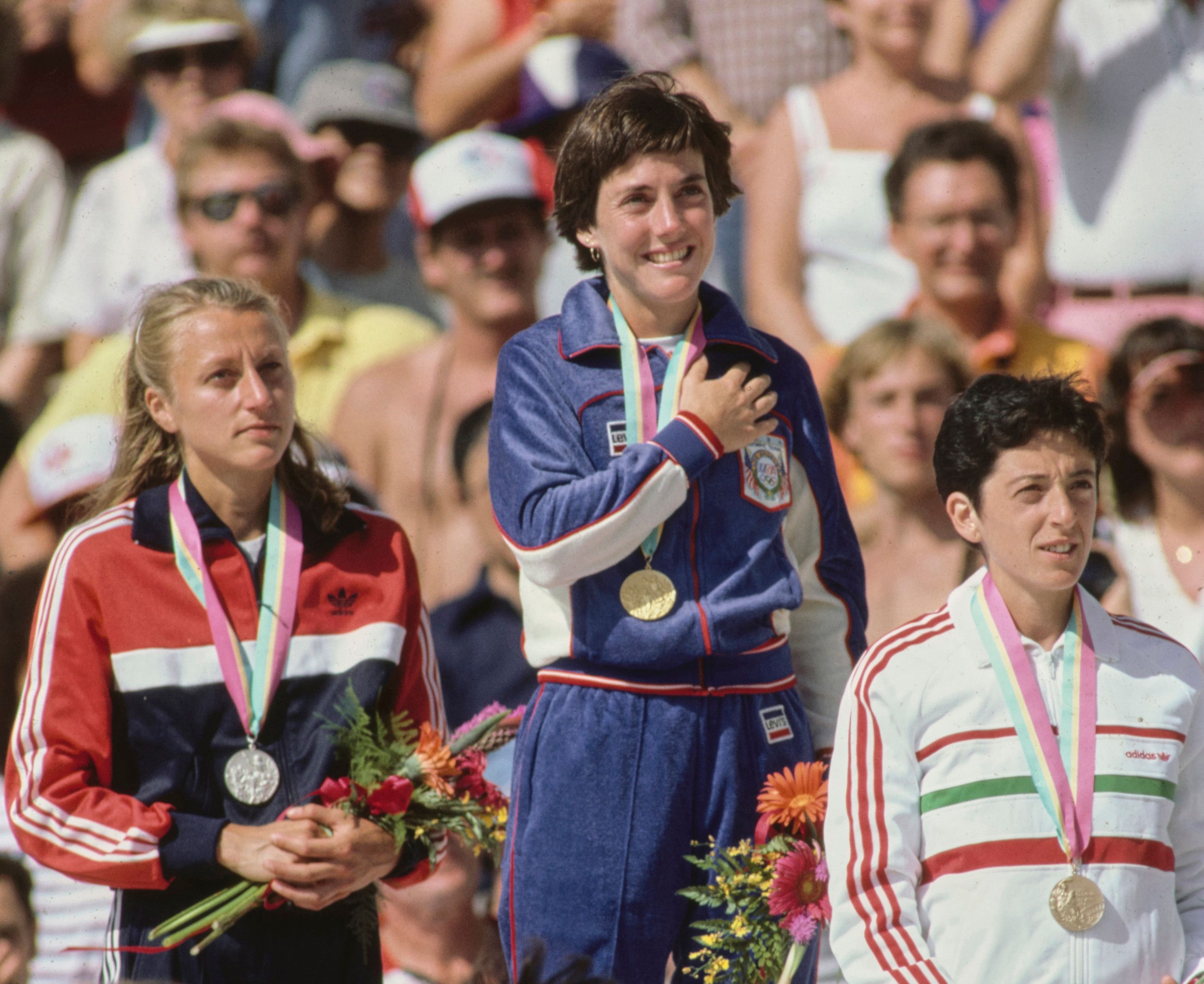 Grete Waitz, Joan Benoit and Rosa Mota receive their marathon medals at the 1984 Los Angeles Olympics