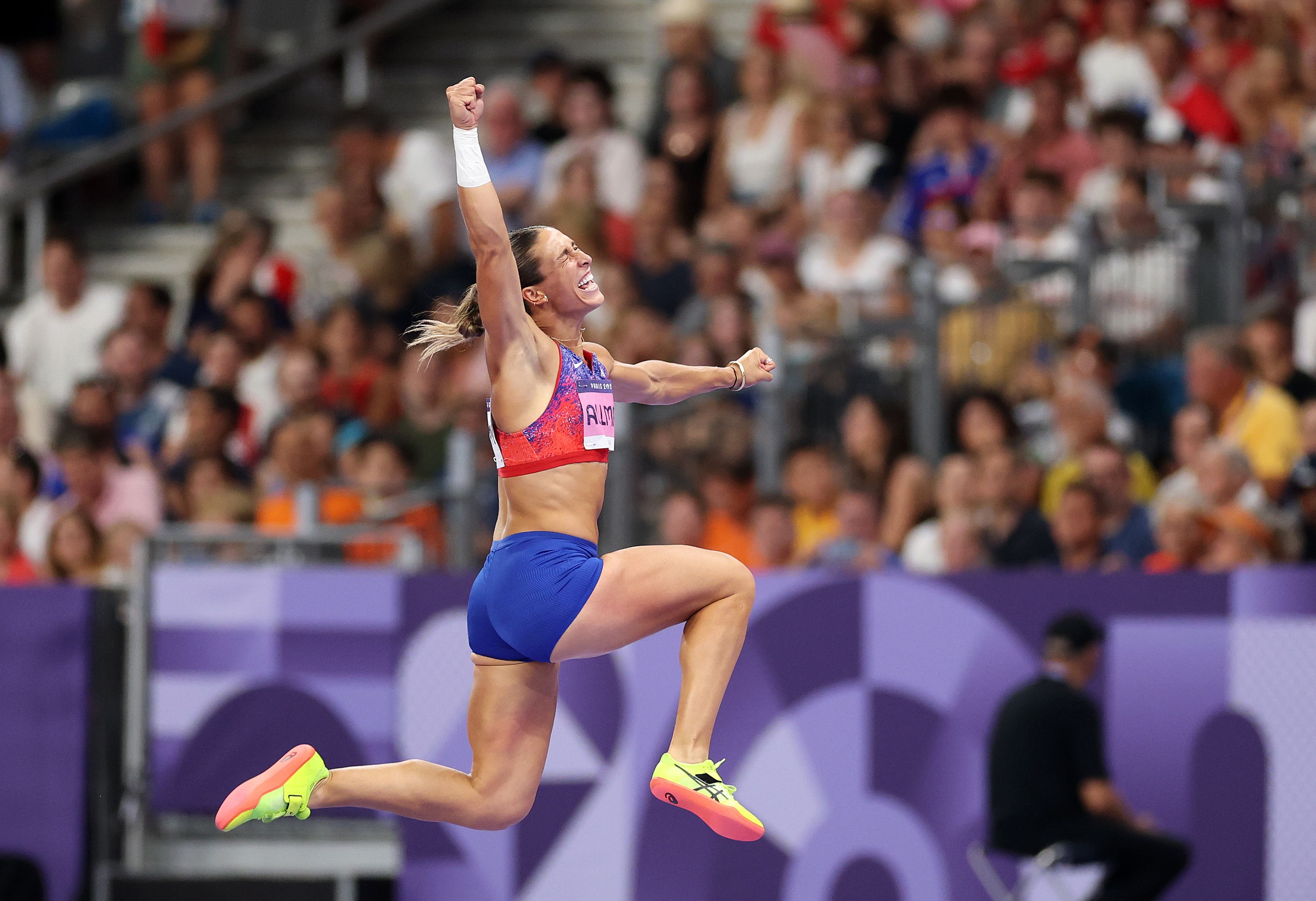 Valarie Allman celebrates her win at the Paris Olympics