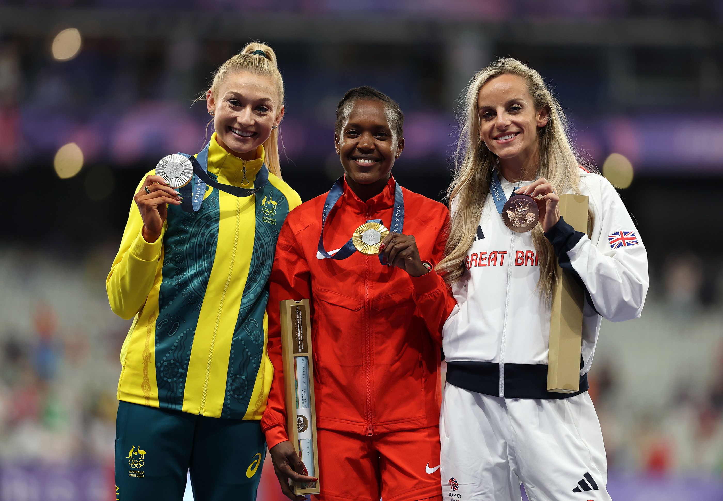 Jessica Hull with her fellow Olympic 1500m medallists - champion Faith Kipyegon and bronze medallist Georgia Bell