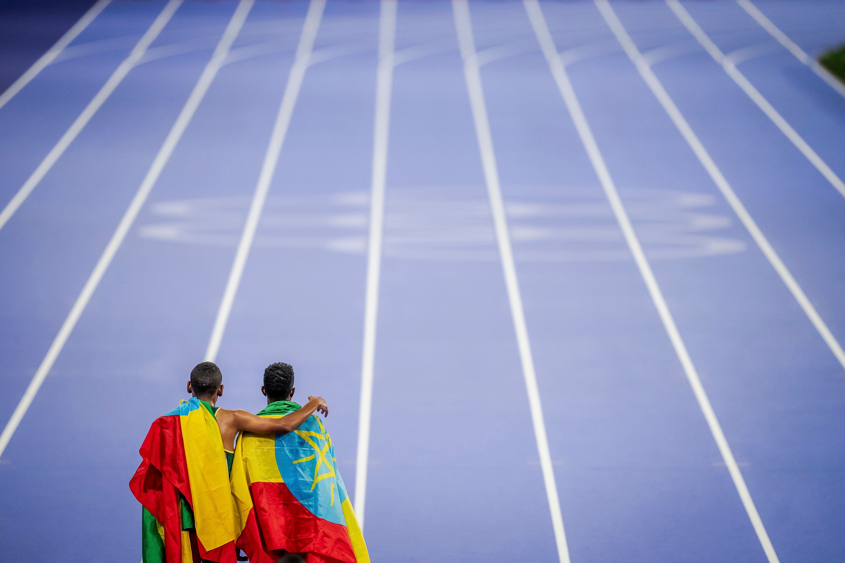 (Photo of the Year 2024 shortlist) Selemon Barega and Berihu Aregawi after the 10,000m at the 2024 Olympic Games