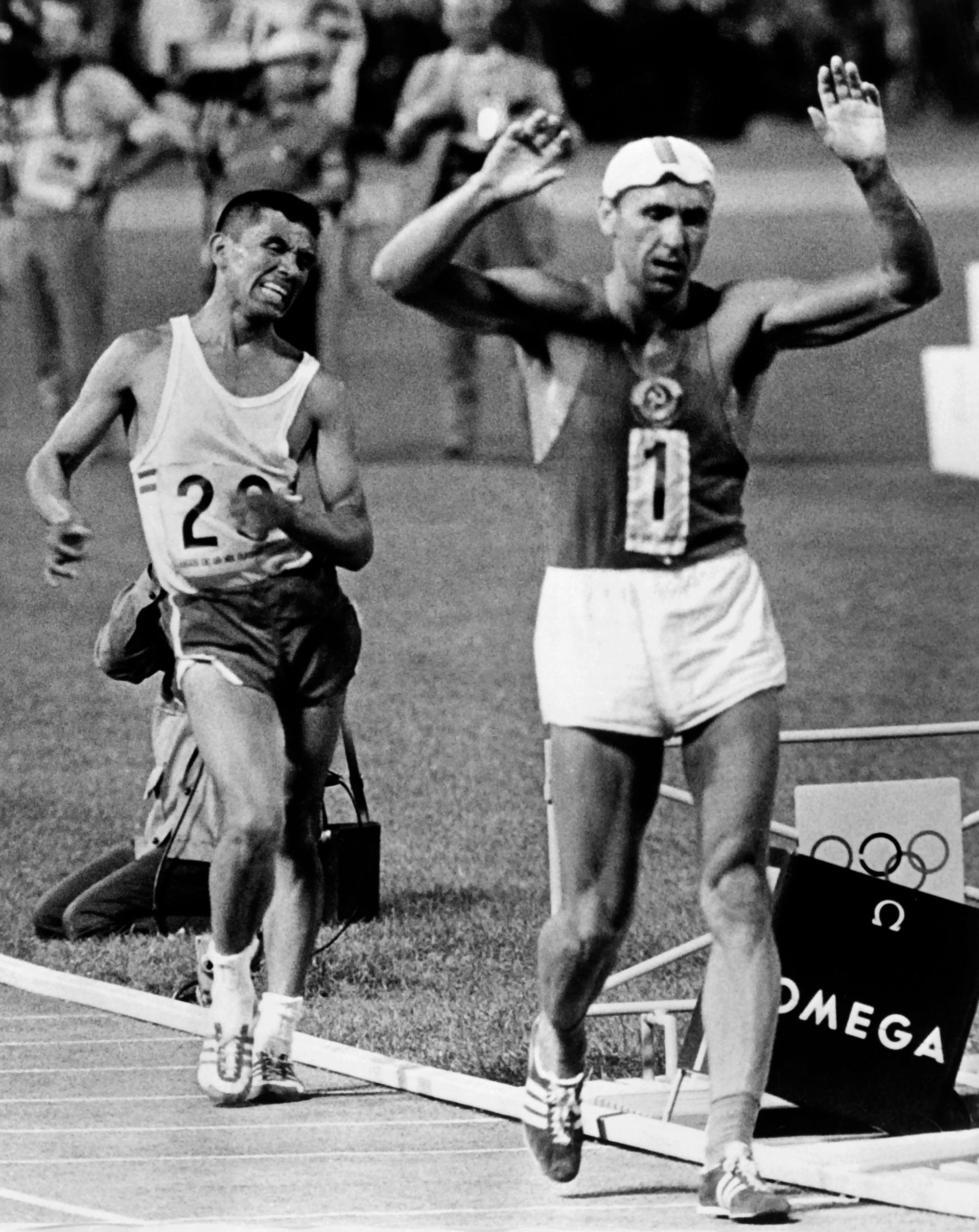 Jose Pedraza (left) takes 20km race walk silver at the 1968 Olympics