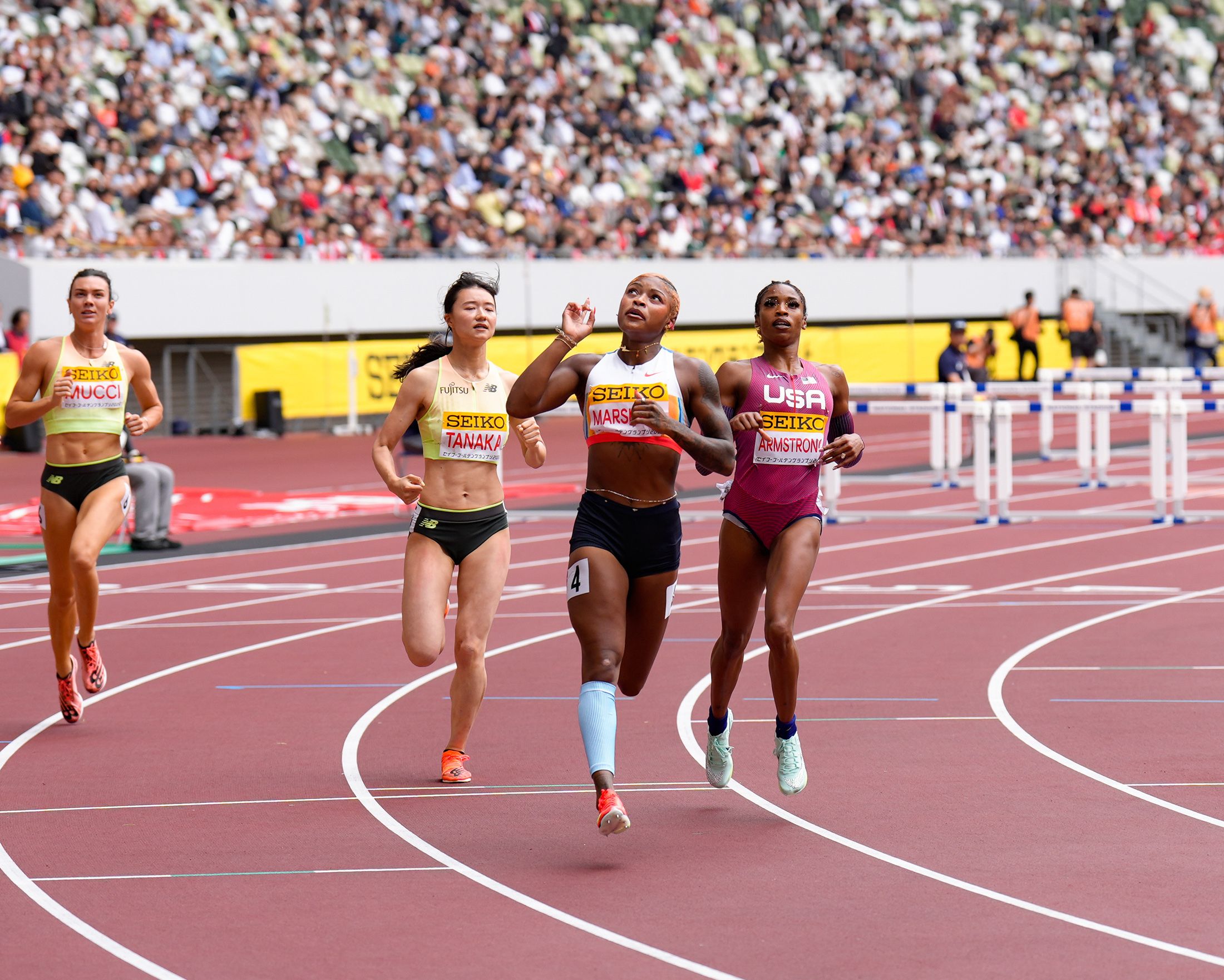 Tonea Marshall wins the 100m hurdles in Tokyo