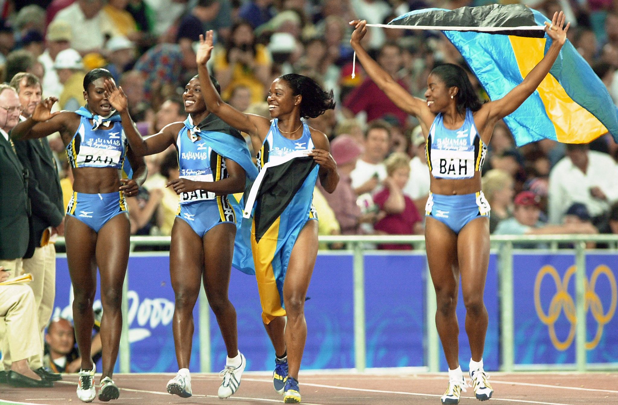 Pauline Davis-Thompson, Sevatheda Fynes, Chandra Sturrup and Debbie Ferguson of The Bahamas celebrate in Sydney