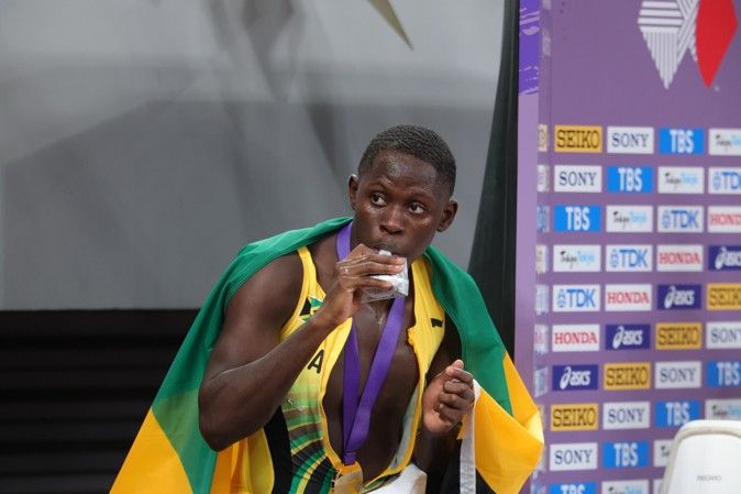 Oblique Seville enjoys a Morinaga product after the 100m final in Tokyo