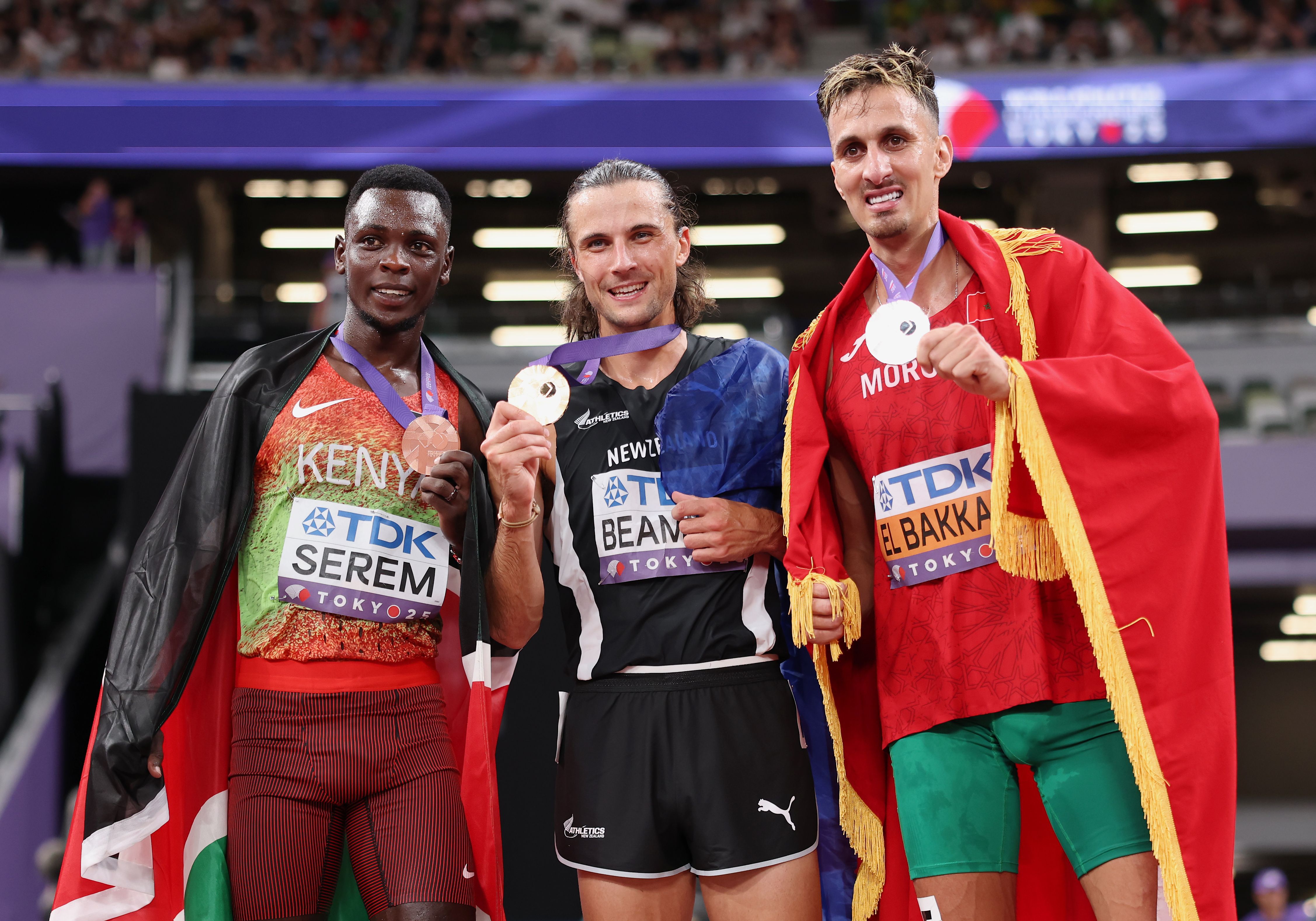 Edmund Serem with his fellow world steeplechase medallists Geordie Beamish and Soufiane El Bakkali