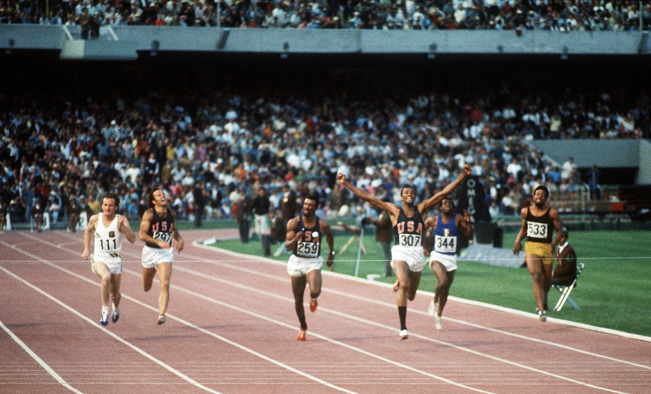 Tommie Smith wins the 1968 Olympic 200m title