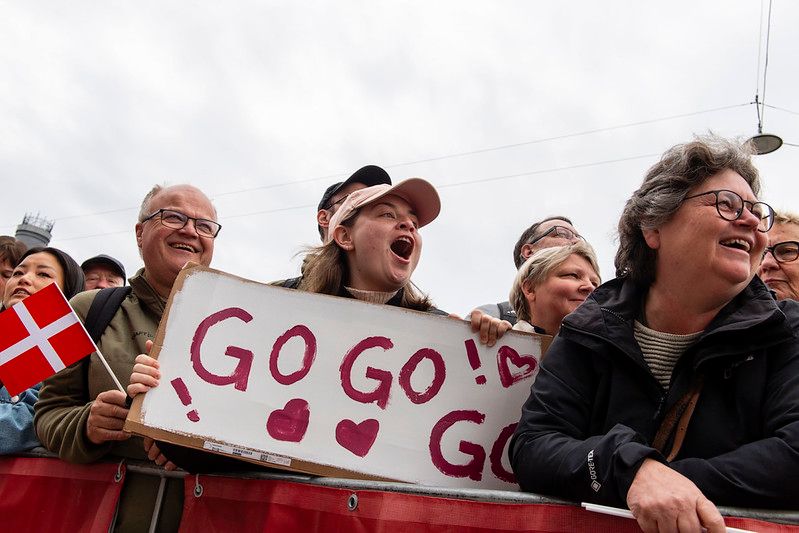 Spectators cheering on runners