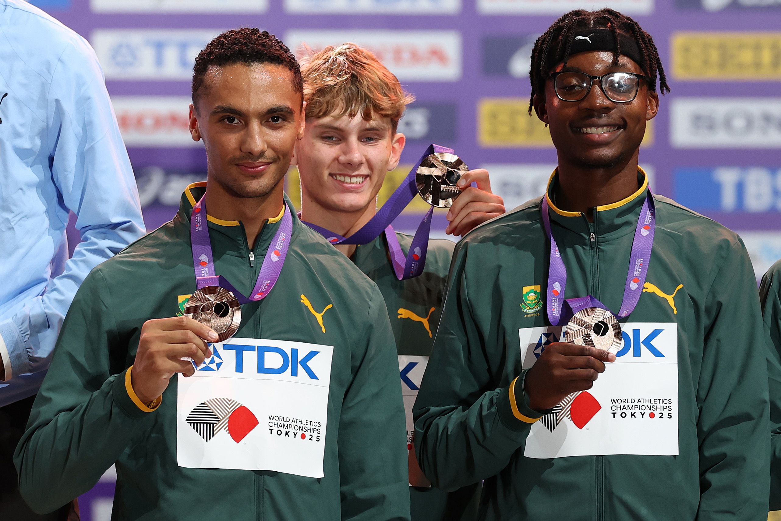 Lythe Pillay, Leendert Koekemoer and Udeme Okon on the podium at the 2025 World Championships