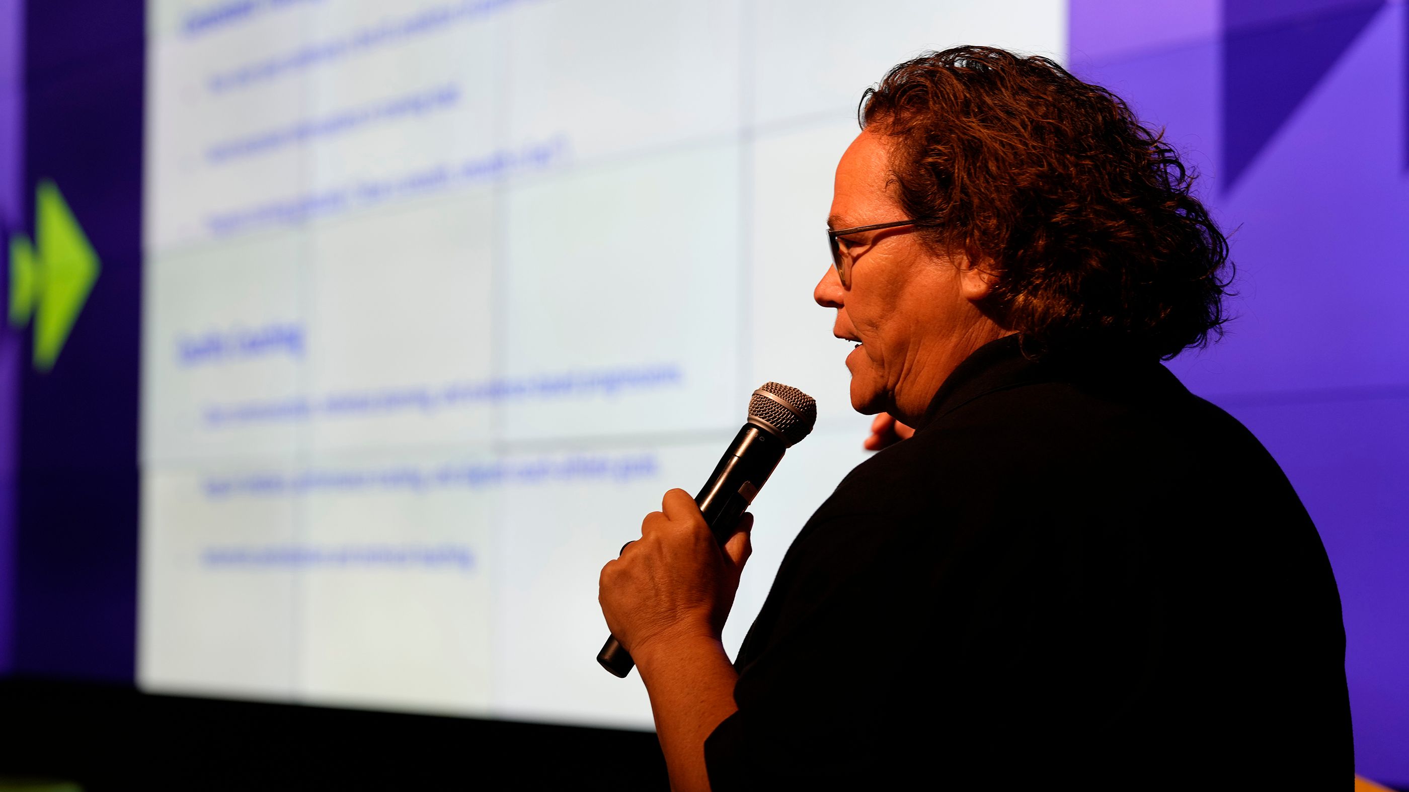 Kim Cousins speaks during the coach symposium in Oregon