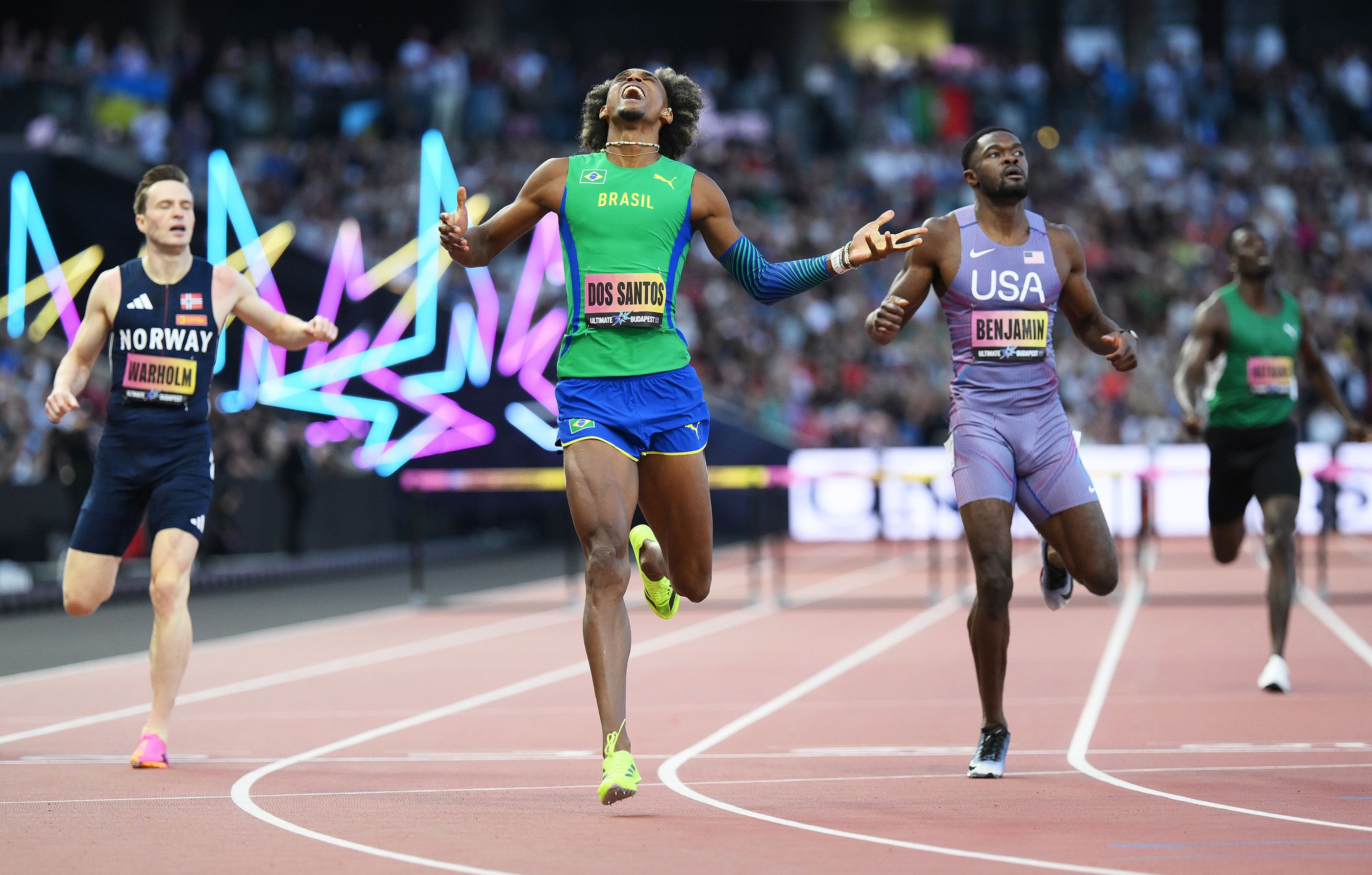 Alison dos Santos celebrates his 400m hurdles win at the World Athletics Ultimate Championship