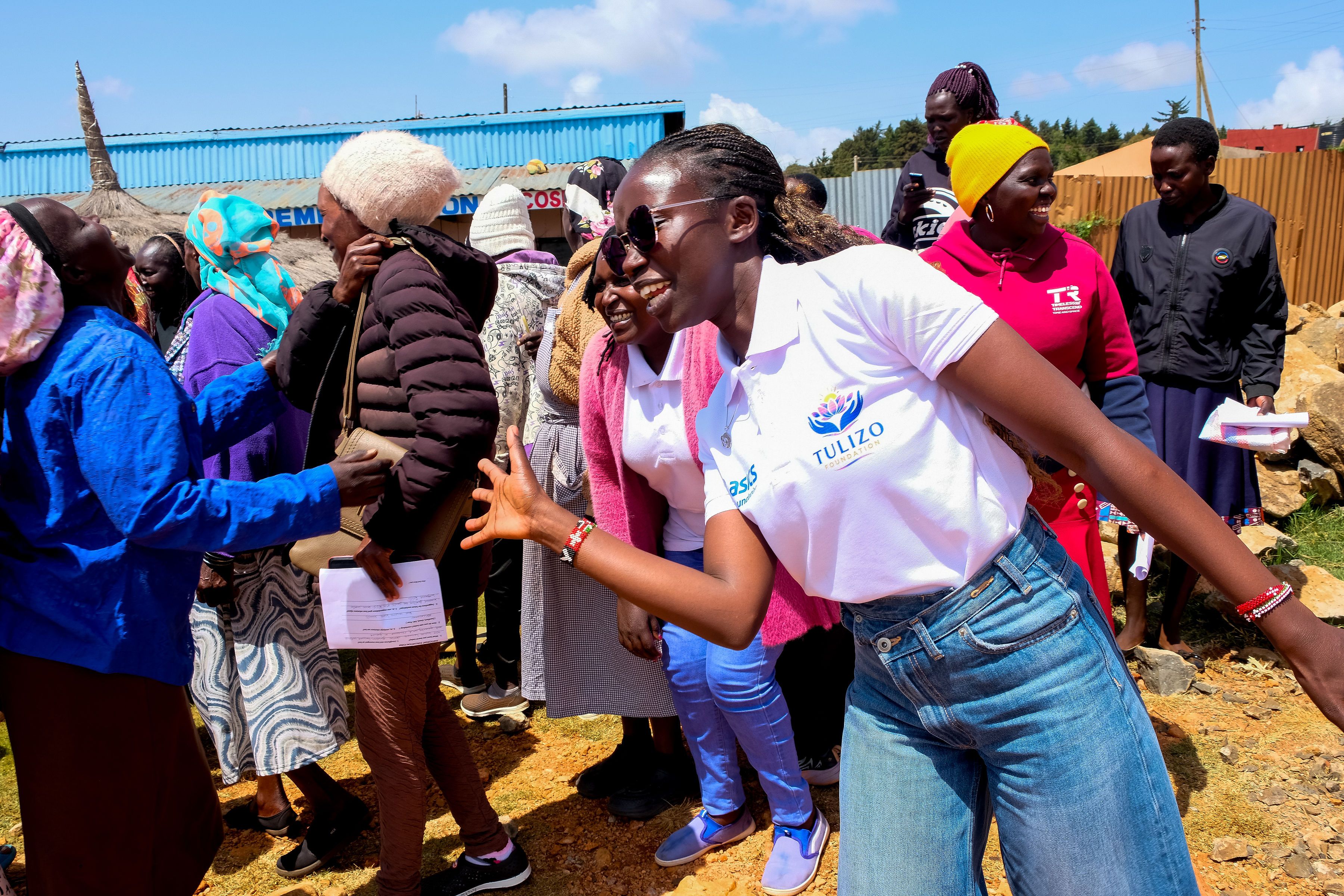 Kolly Wanders leads the ice-breaker dance at the Tulizo Foundation workshop