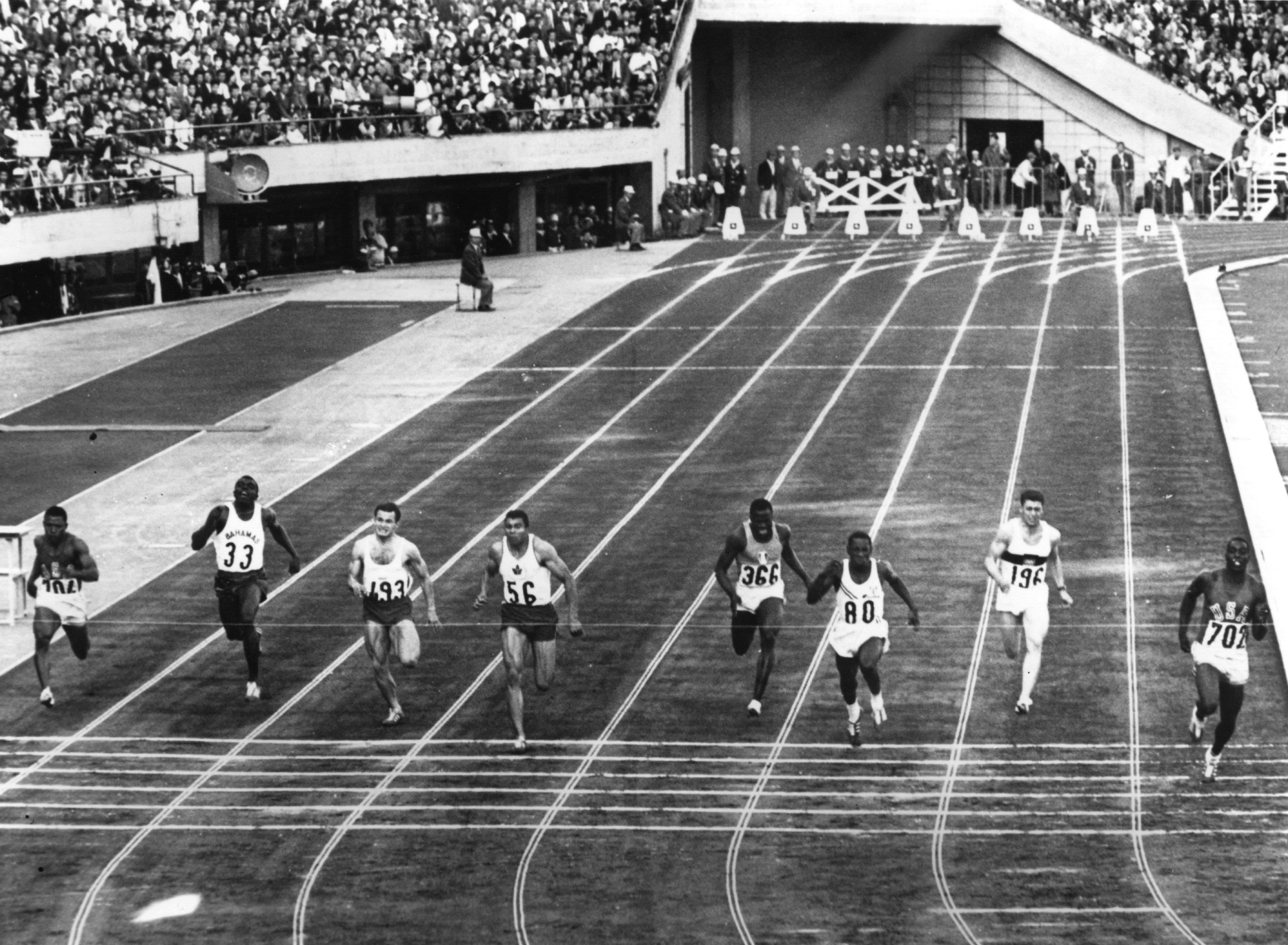 Bob Hayes (lane one) wins the 1964 Olympic 100m title