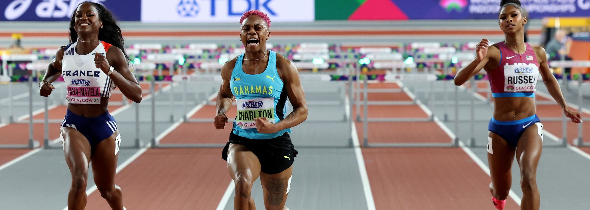 Devynne Charlton of The Bahamas lowered the 60m hurdles world record to 7.65 as she secured her first global title