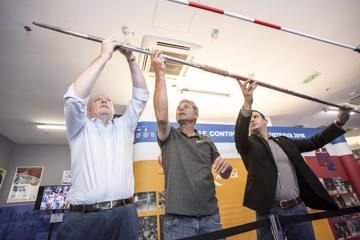l to r: Chris Turner, Jan Zelezny and Valter Bocek attach Zelezny's world record javelin to a display in the IAAF Heritage Exhibition in Ostrava 