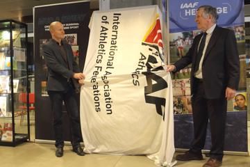 Jakob Larsen, DAF General Secretary and Robin Brooke-Smith, Archivist of Shrewsbury School, unveil a cabinet at the opening ceremony of the IAAF Heritage XC Display in Aarhus
